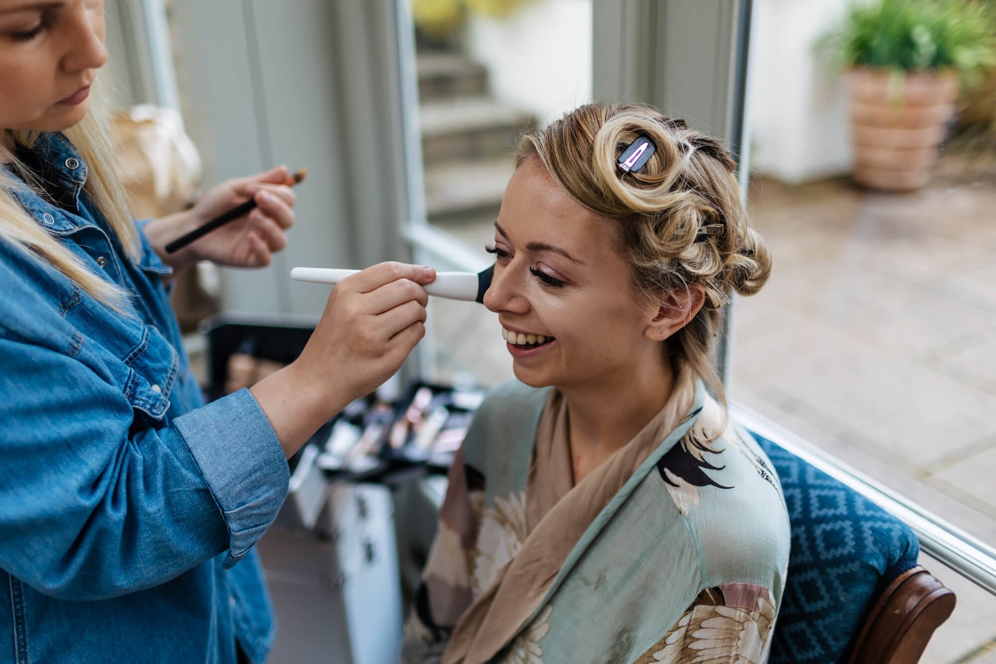 Bride having her makeup applied for her wedding