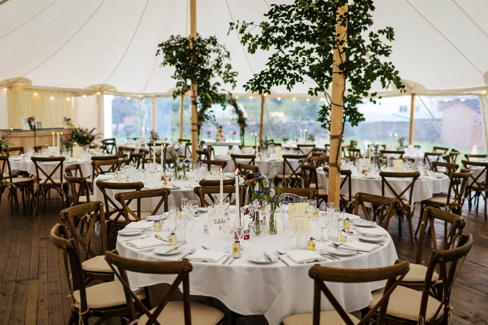 Table decorations in a marquee for a wedding