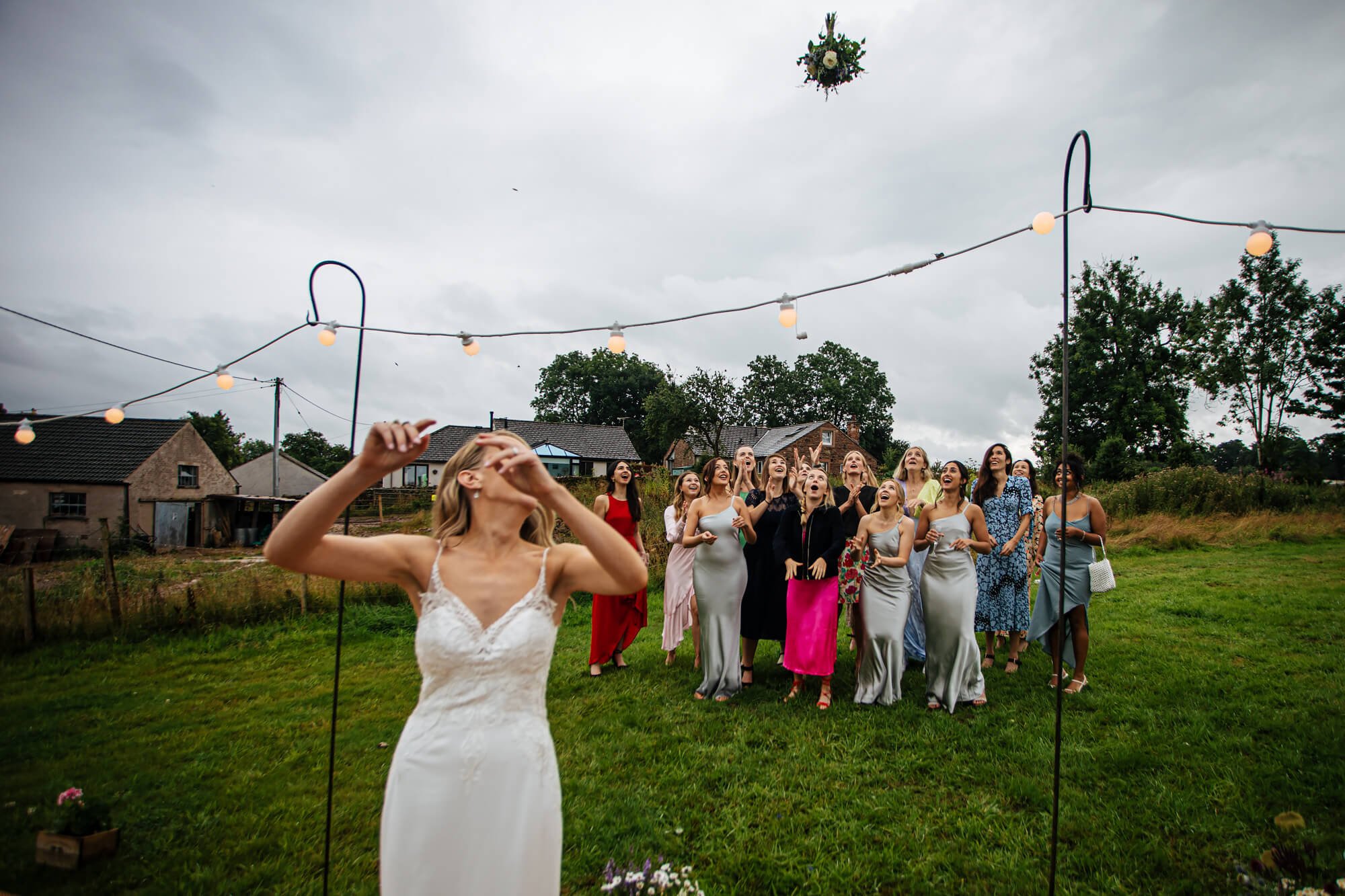 Bouquet toss at a Cumbrian wedding