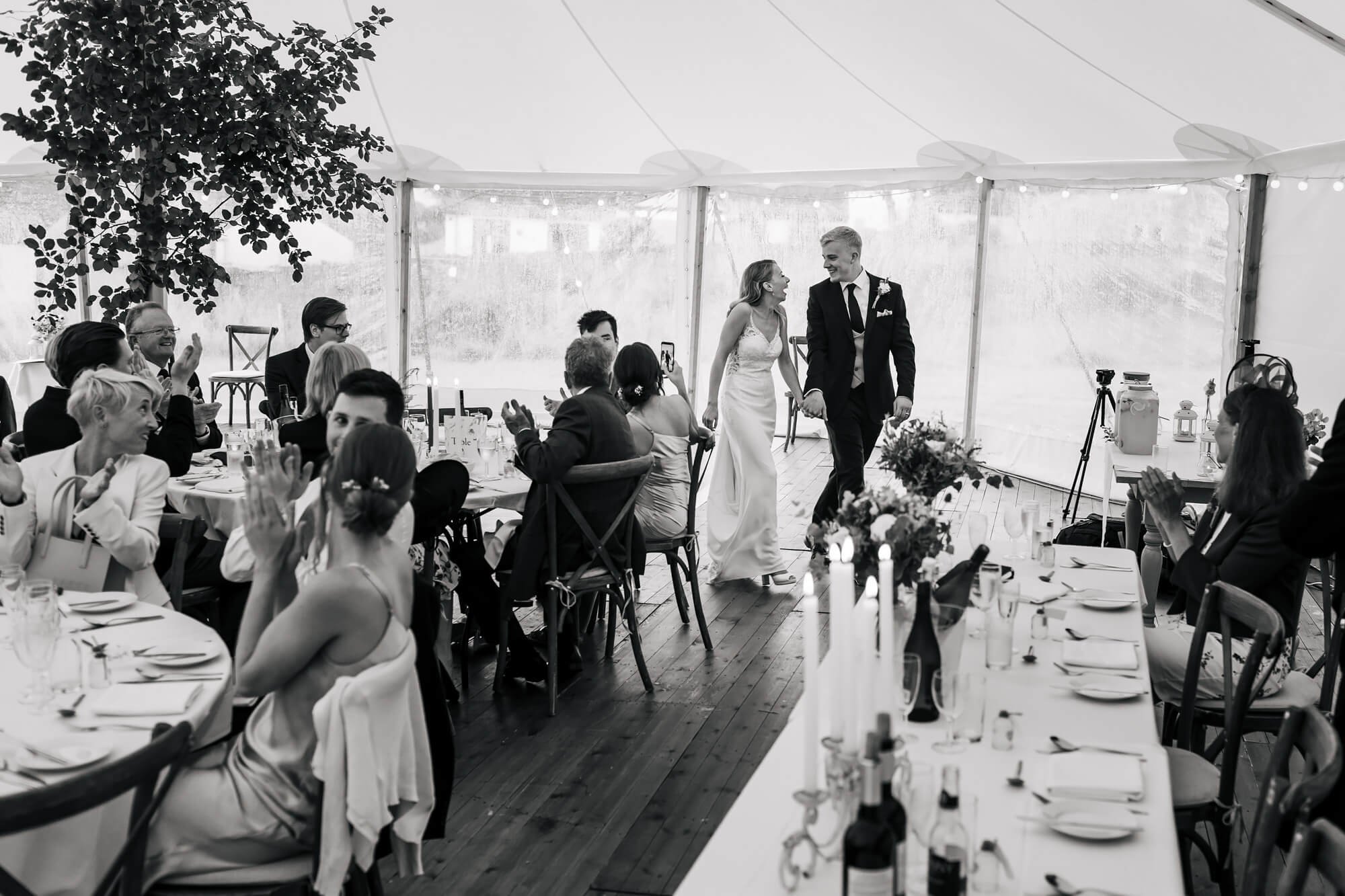 Bride and groom are announced to the reception