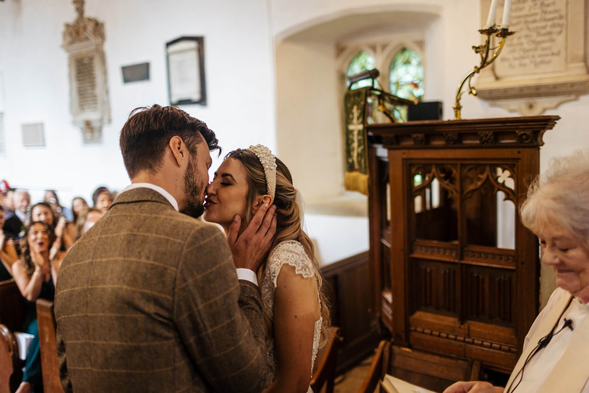 Bride and groom kiss at their wedding