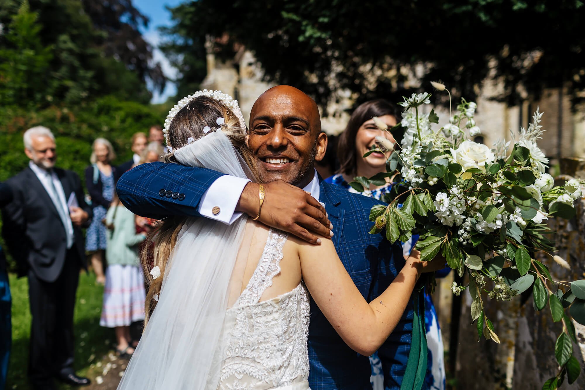 Bride hugs a wedding guest after the ceremony