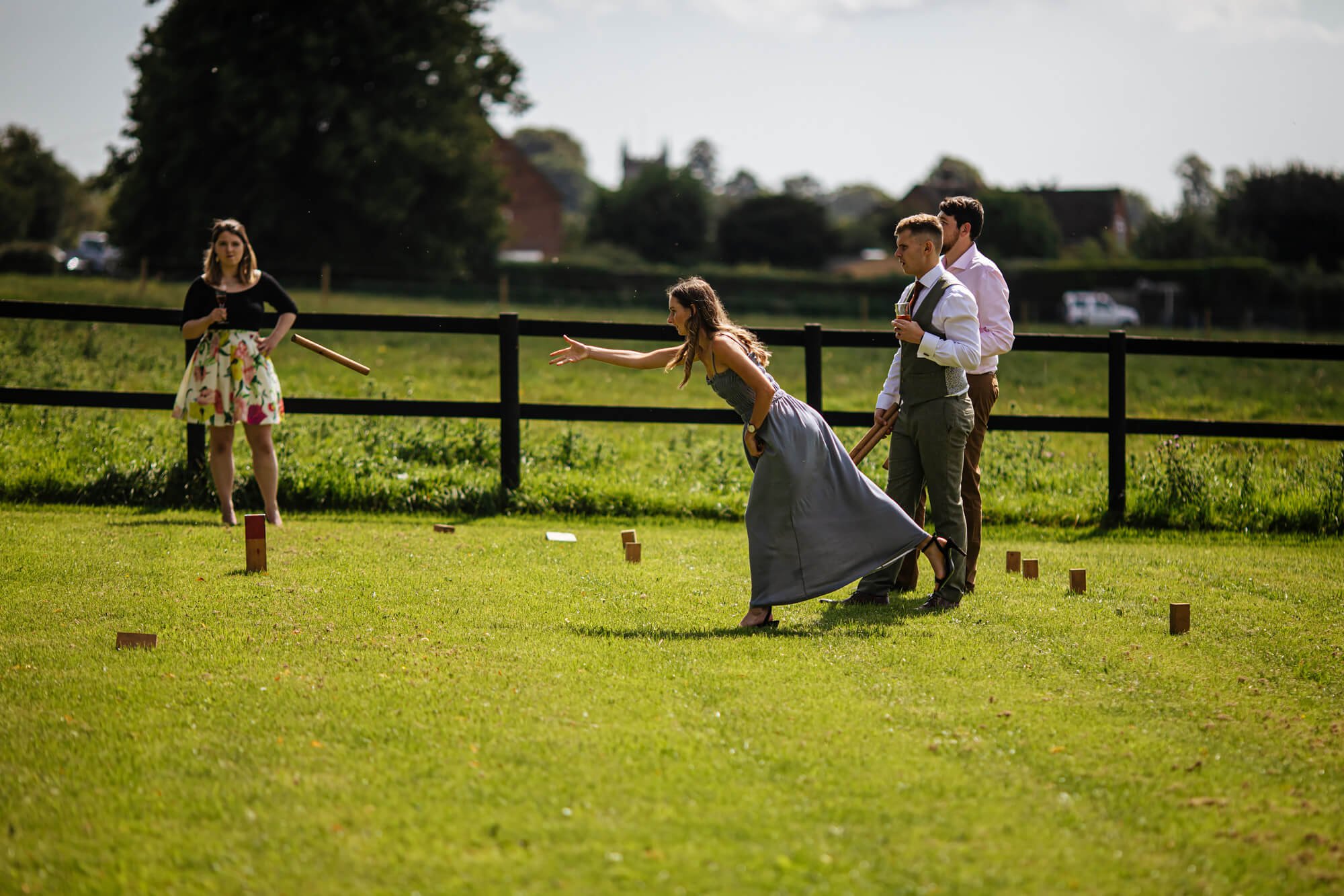 Guests playing games outside at a wedding