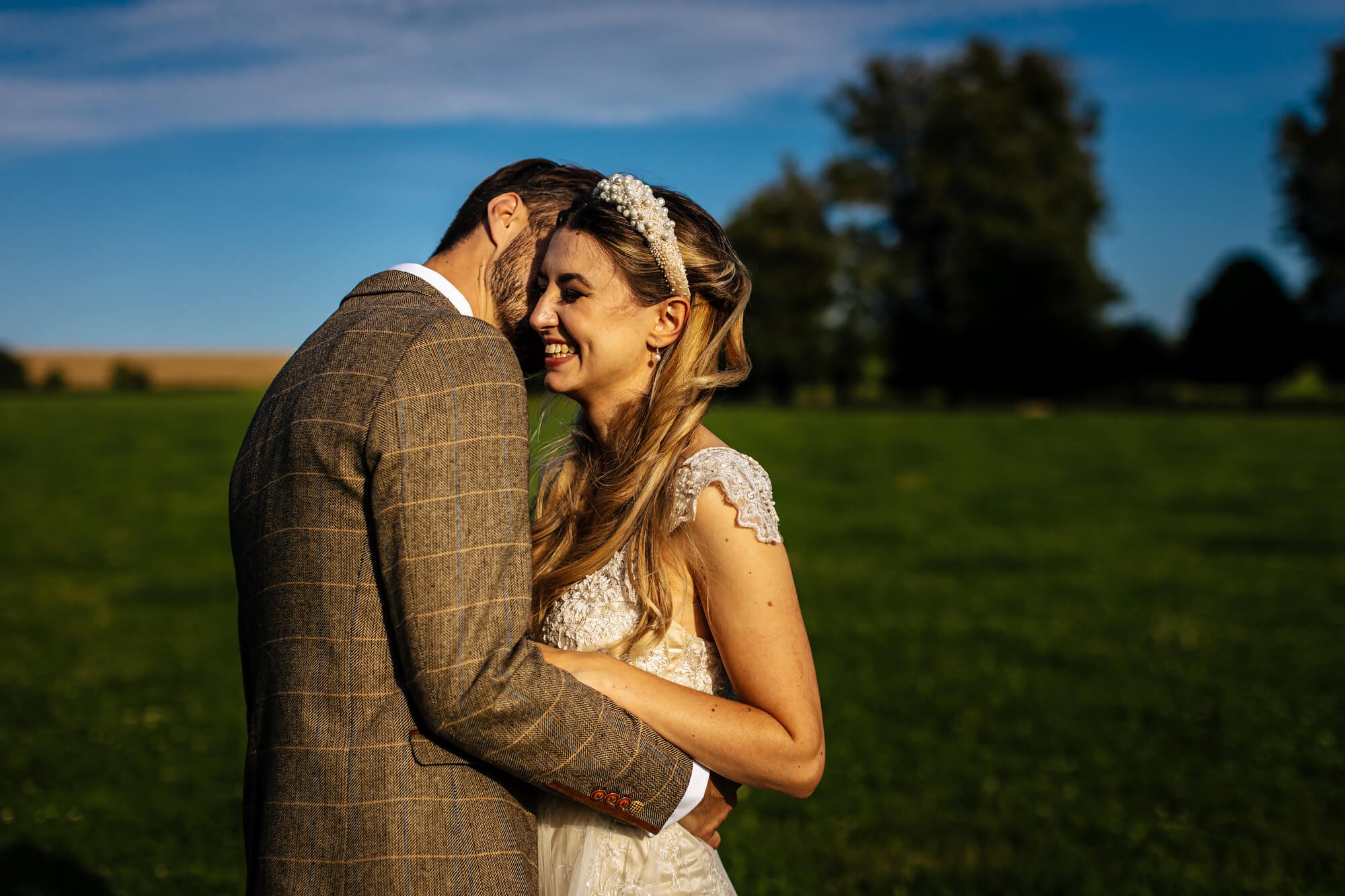 Bride and groom hugging at their wedding