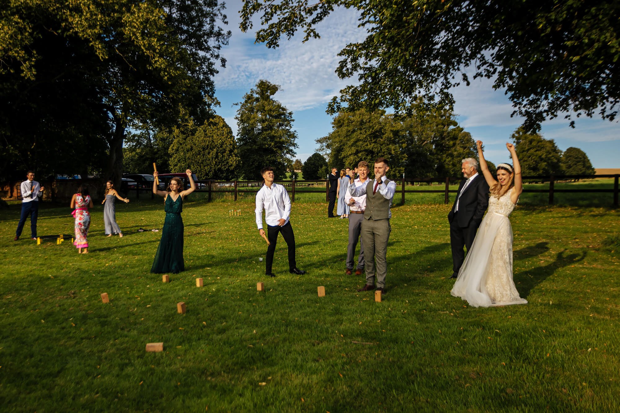 Wedding guests playing games in the garden