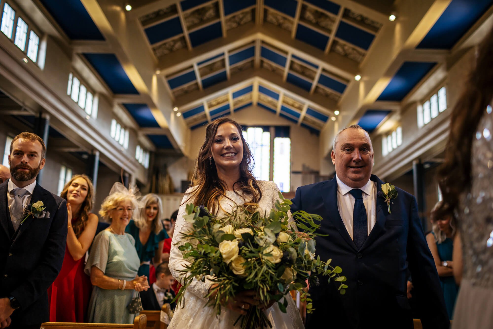 Bride and dad walk down the aisle