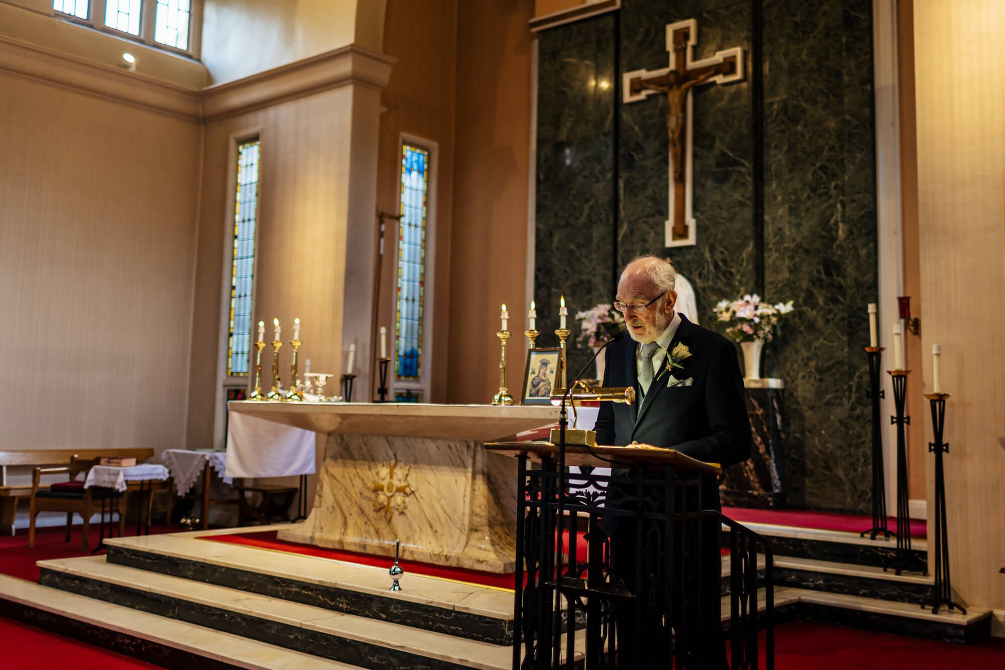 Groom's dad performs a reading at the church ceremony