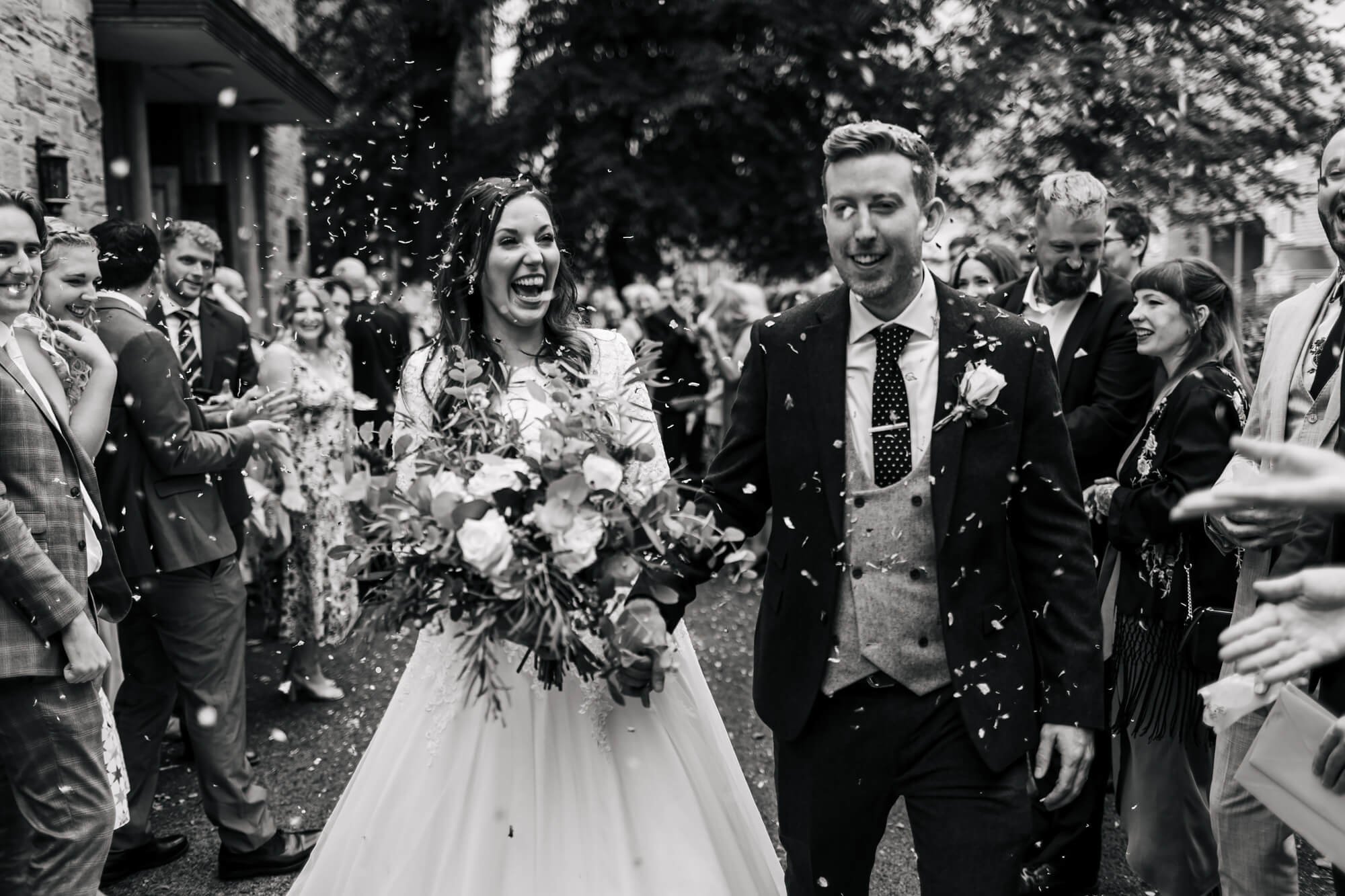 Guests throw confetti at a Leeds wedding