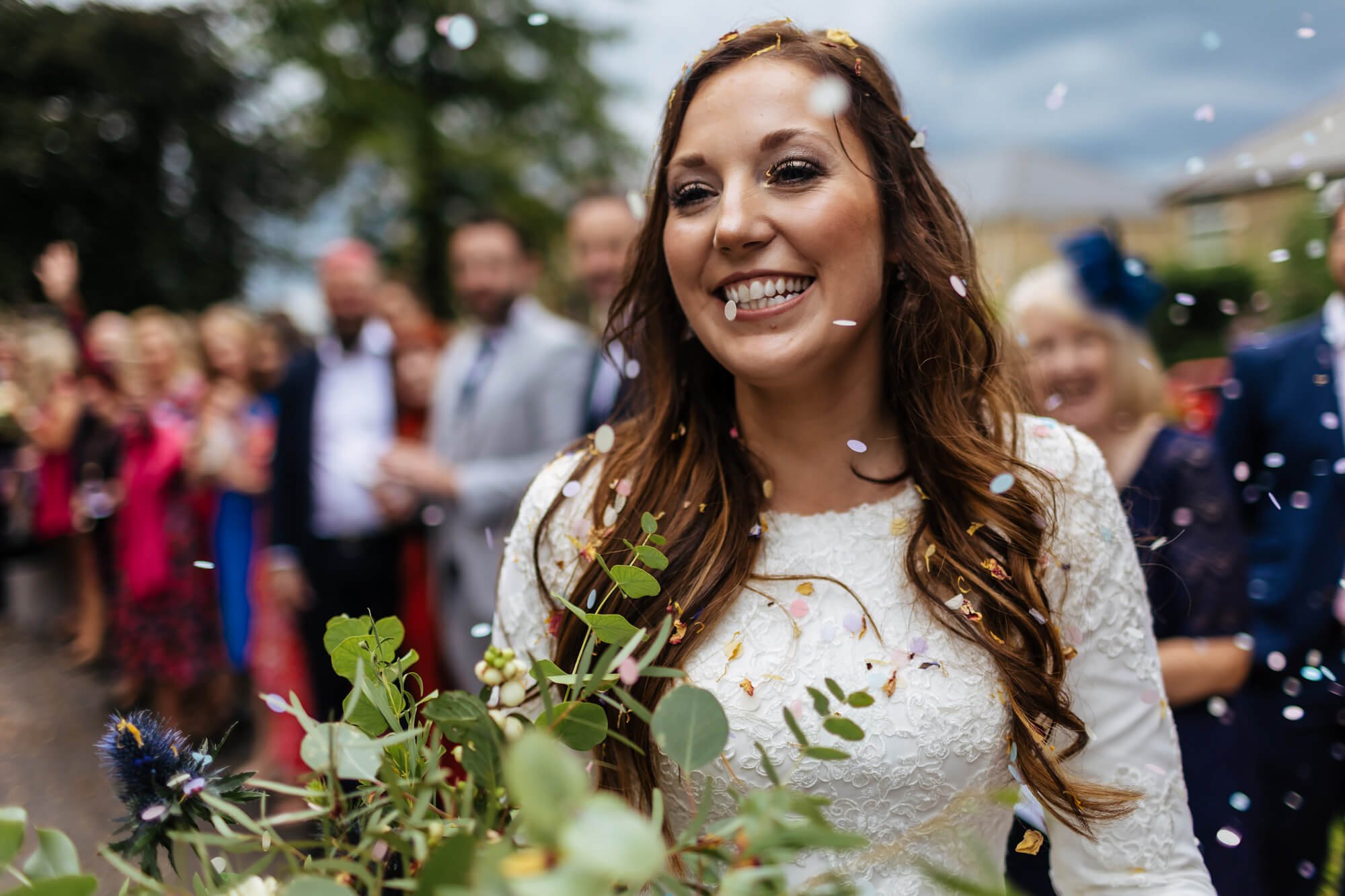Bride with confetti at her wedding in Leeds