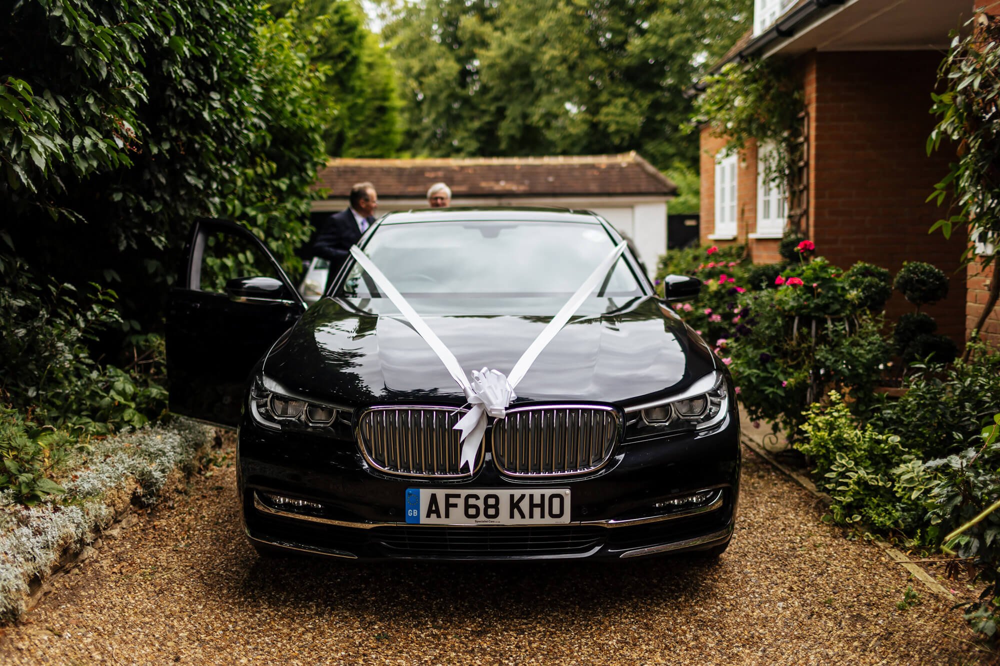 Wedding car with ribbons in the morning