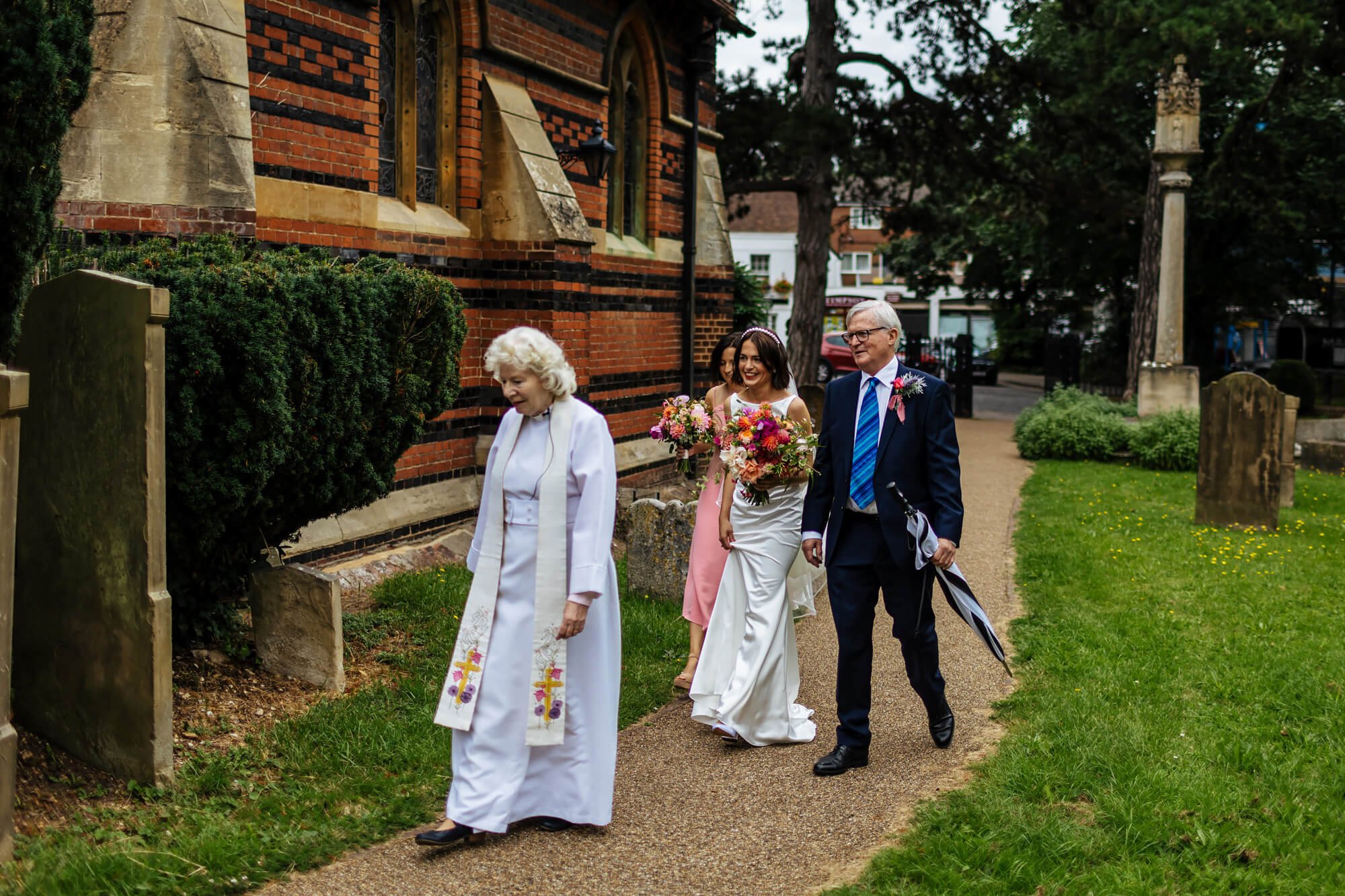 Bride and dad walking into the church for the wedding ceremony