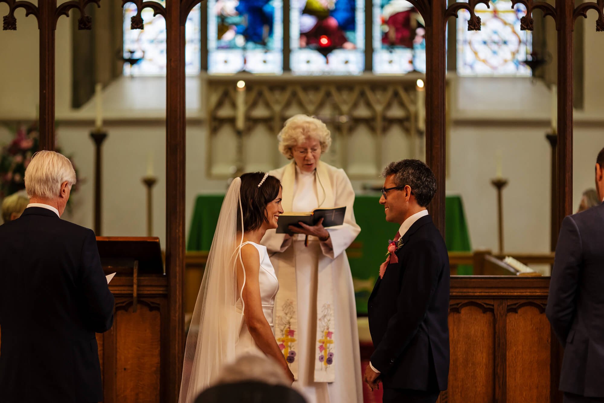 Vicar performing the bride and groom's wedding ceremony