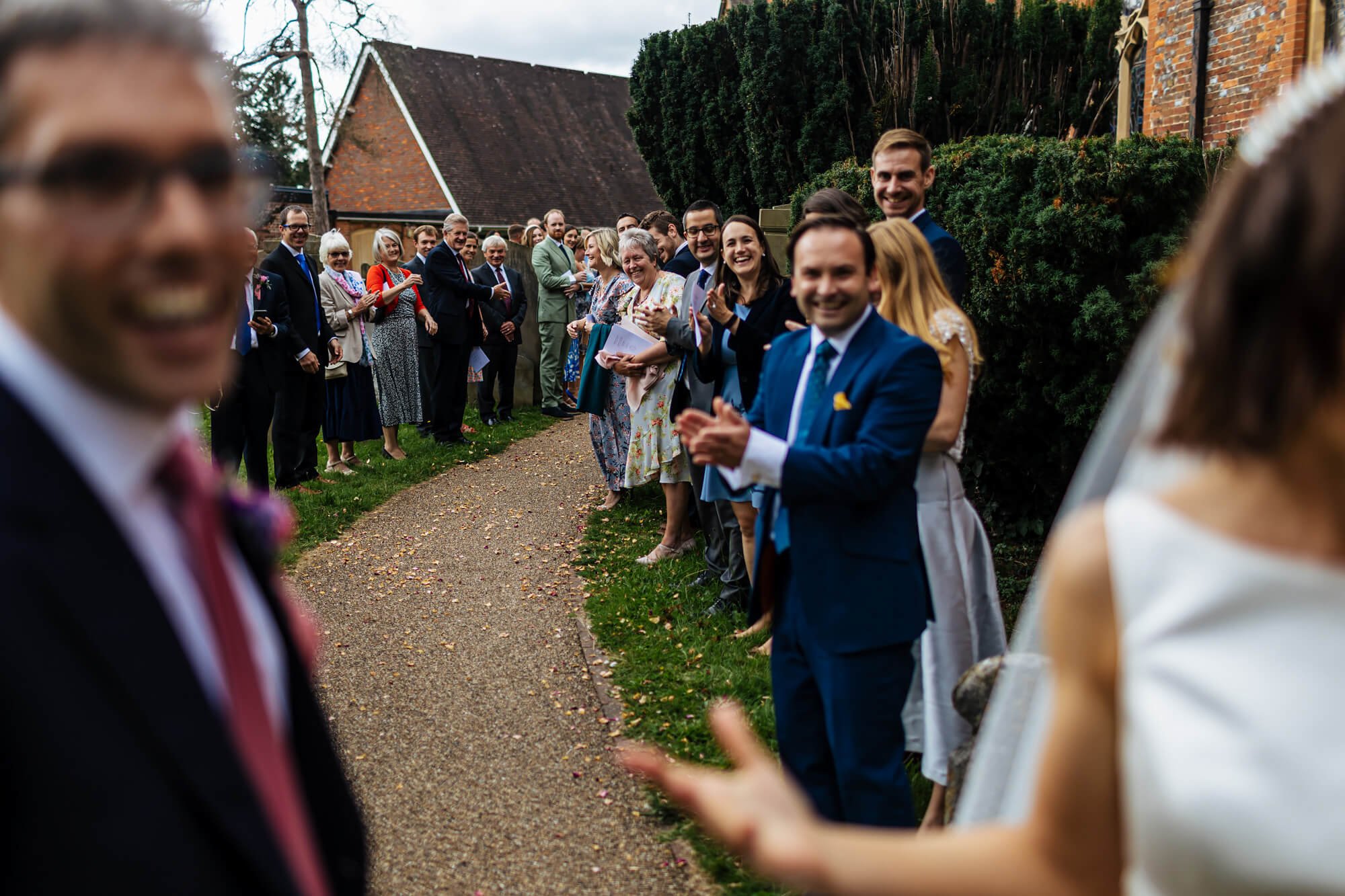 Clapping the newlyweds out of the church