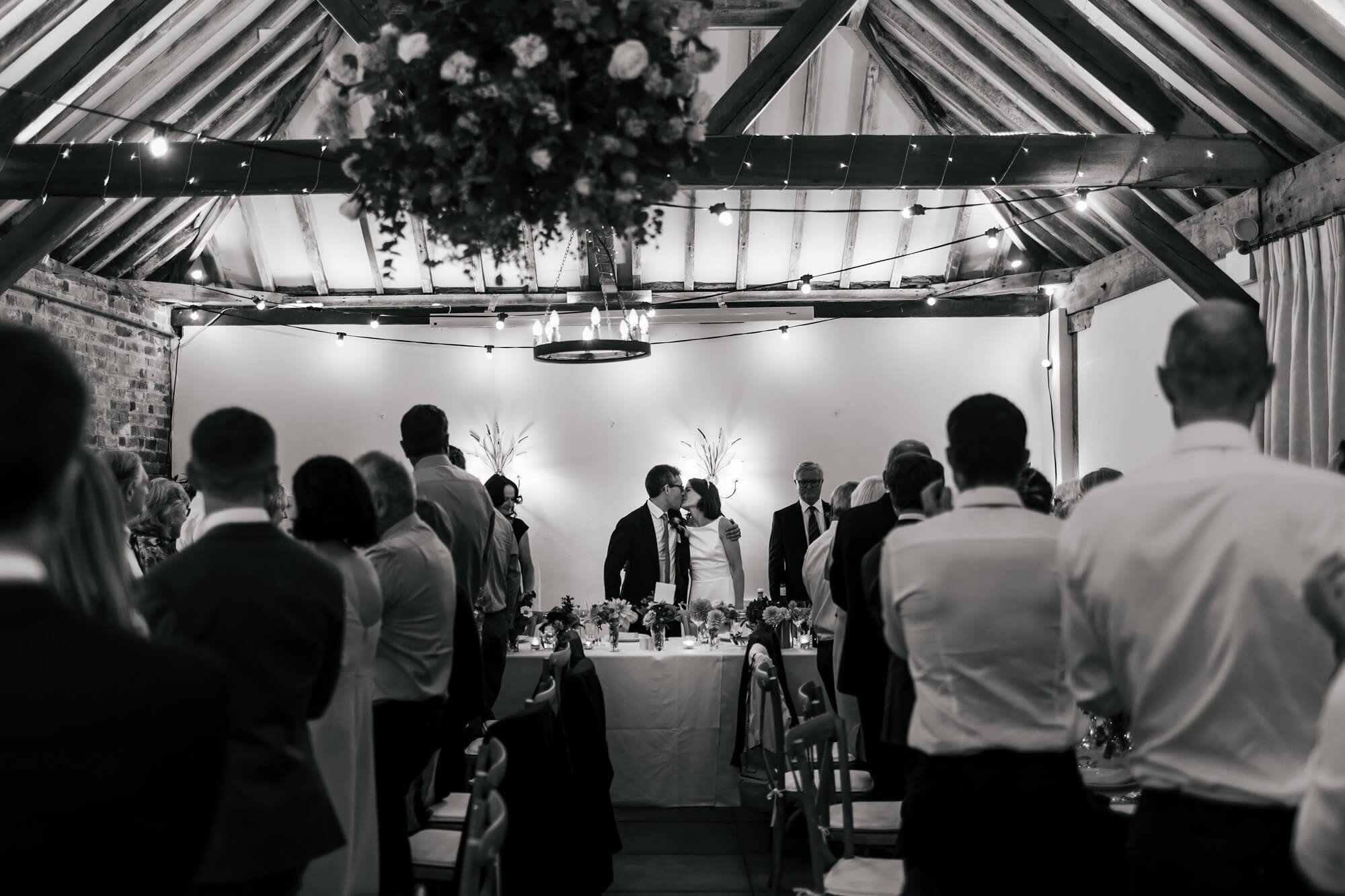 Bride and groom sharing a kiss at their wedding