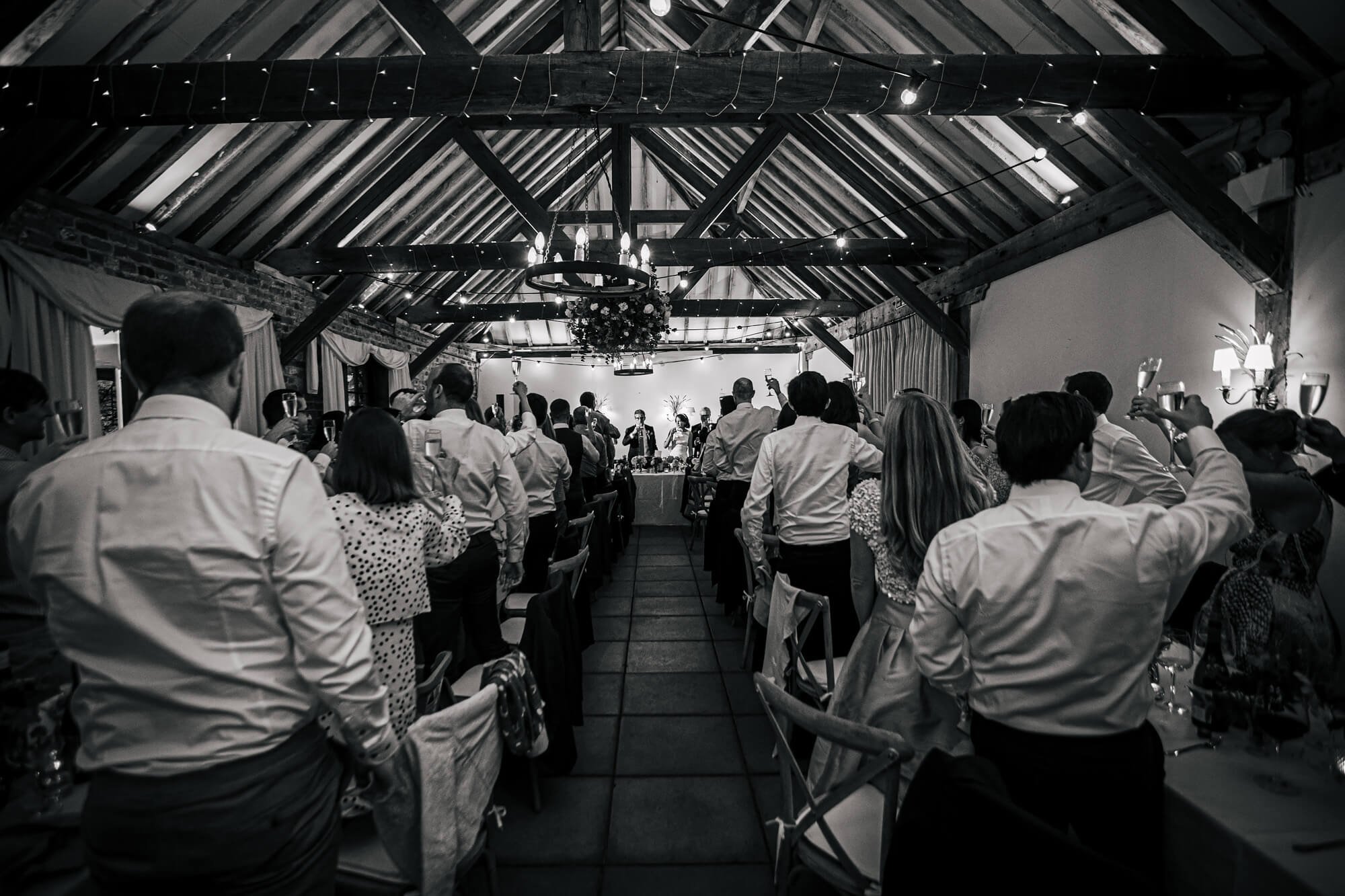 Cheers at a Chenies Manor wedding