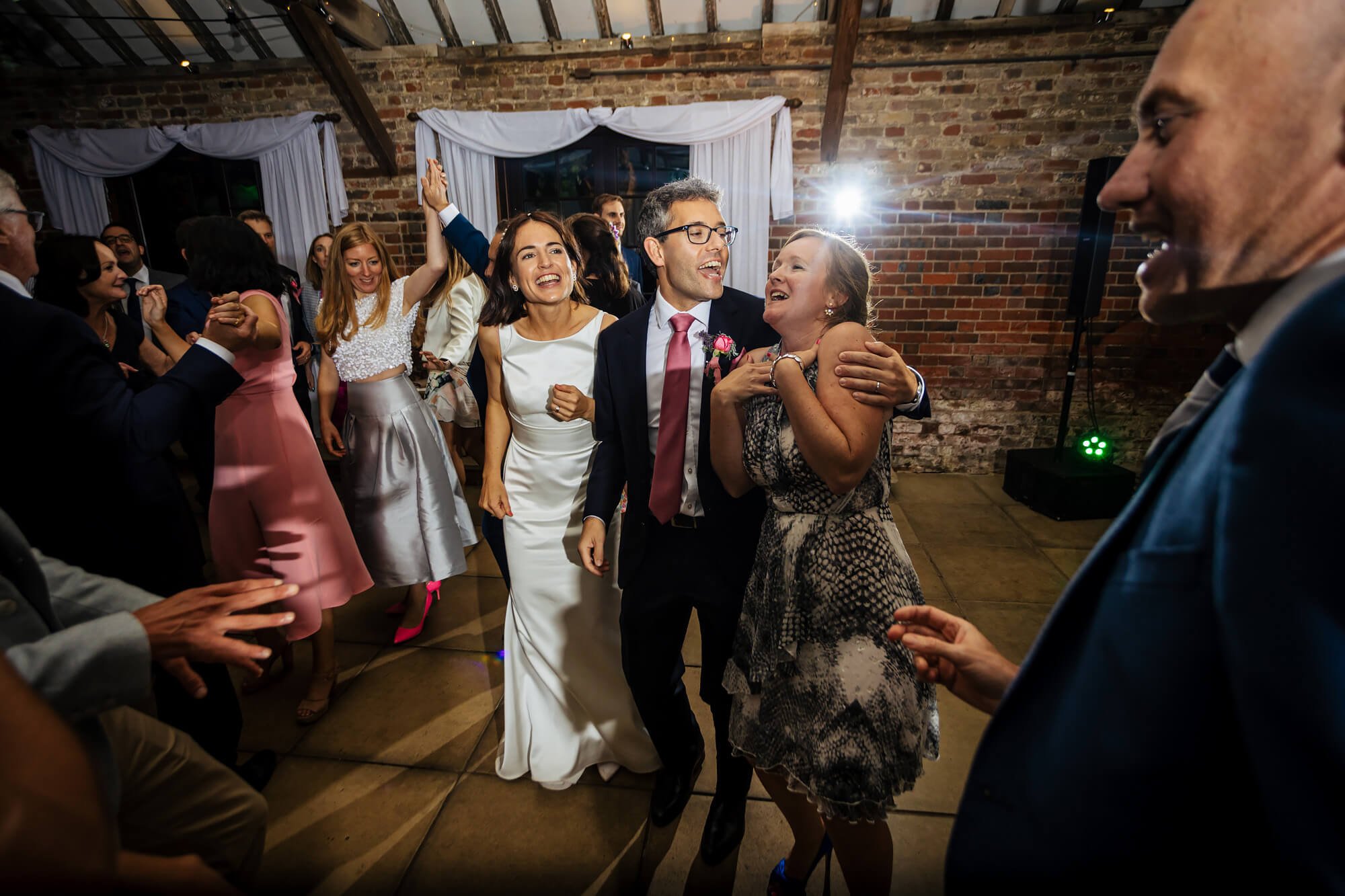 Guests dancing at Chenies Manor wedding