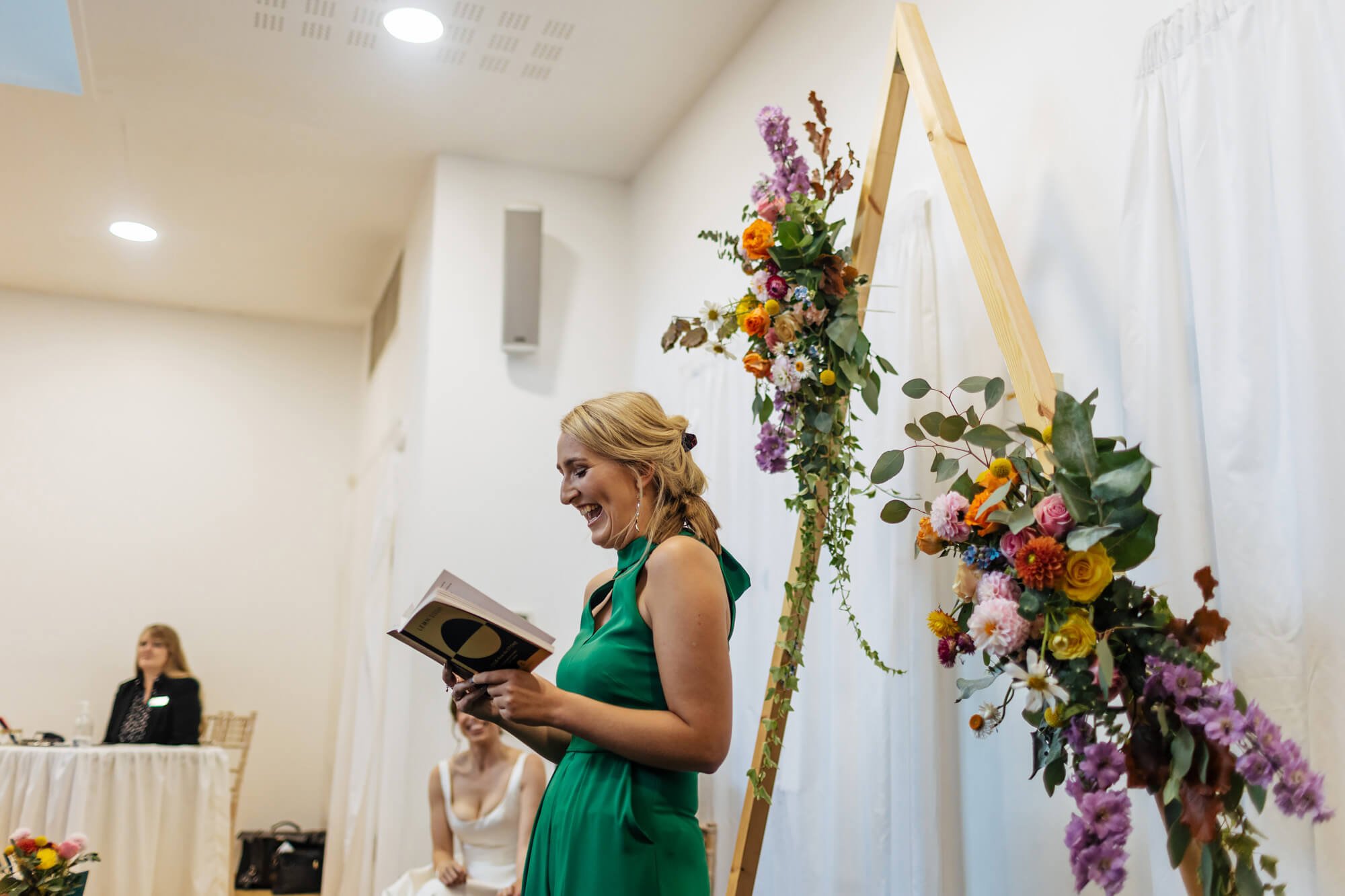 Wedding guests performs a reading during the ceremony