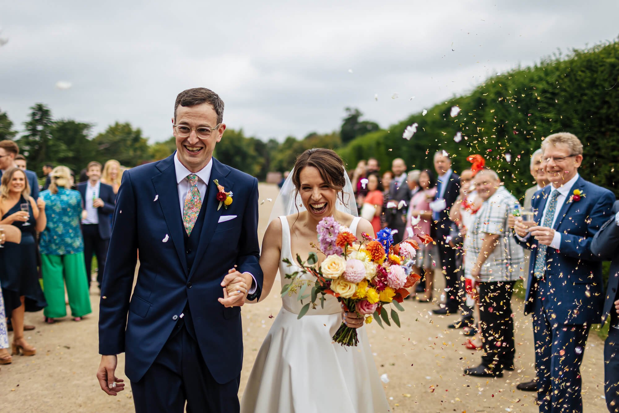 Throwing confetti over the couple at a Yorkshire Sculpture Park wedding