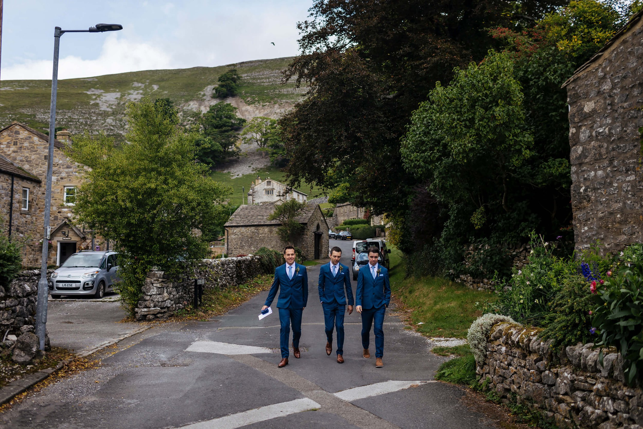 Groom and his best men walking to the ceremony