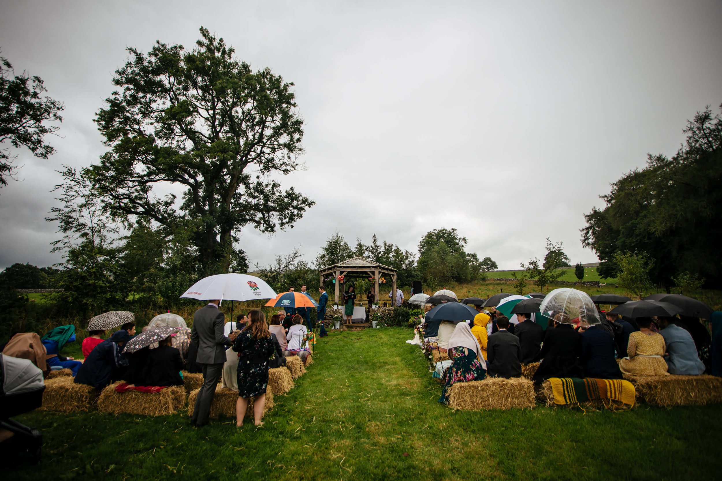 A wet outdoors Yorkshire Dales wedding ceremony