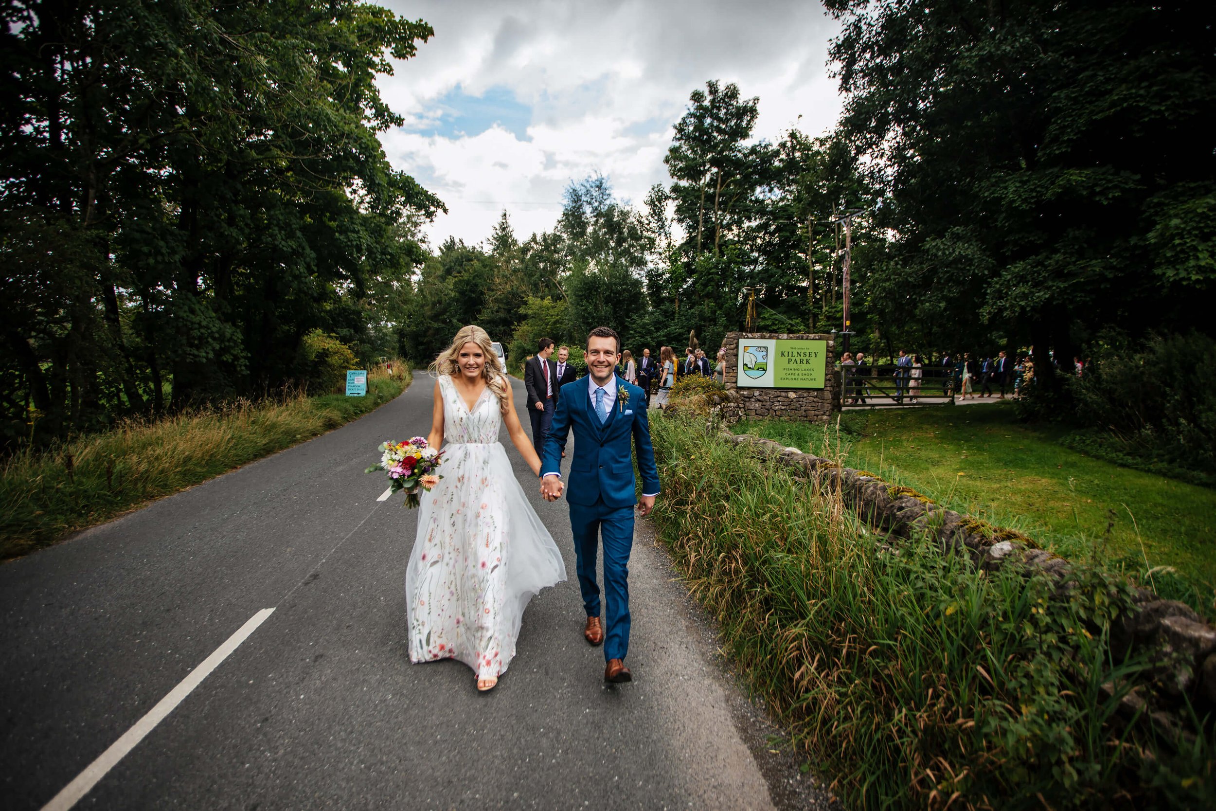 Bride and groom walking down the road at their wedding