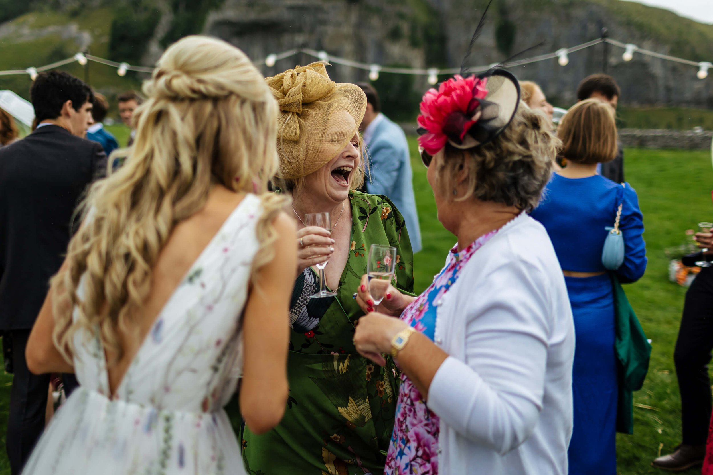 Guests laughing at a wedding in the Yorkshire Dales