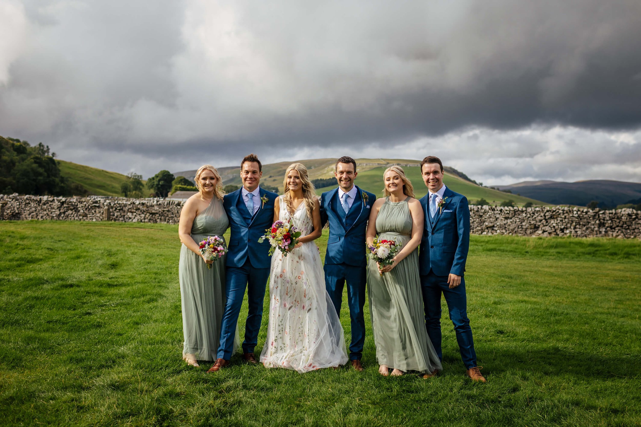 Groomsmen and bridesmaids group shot at a wedding