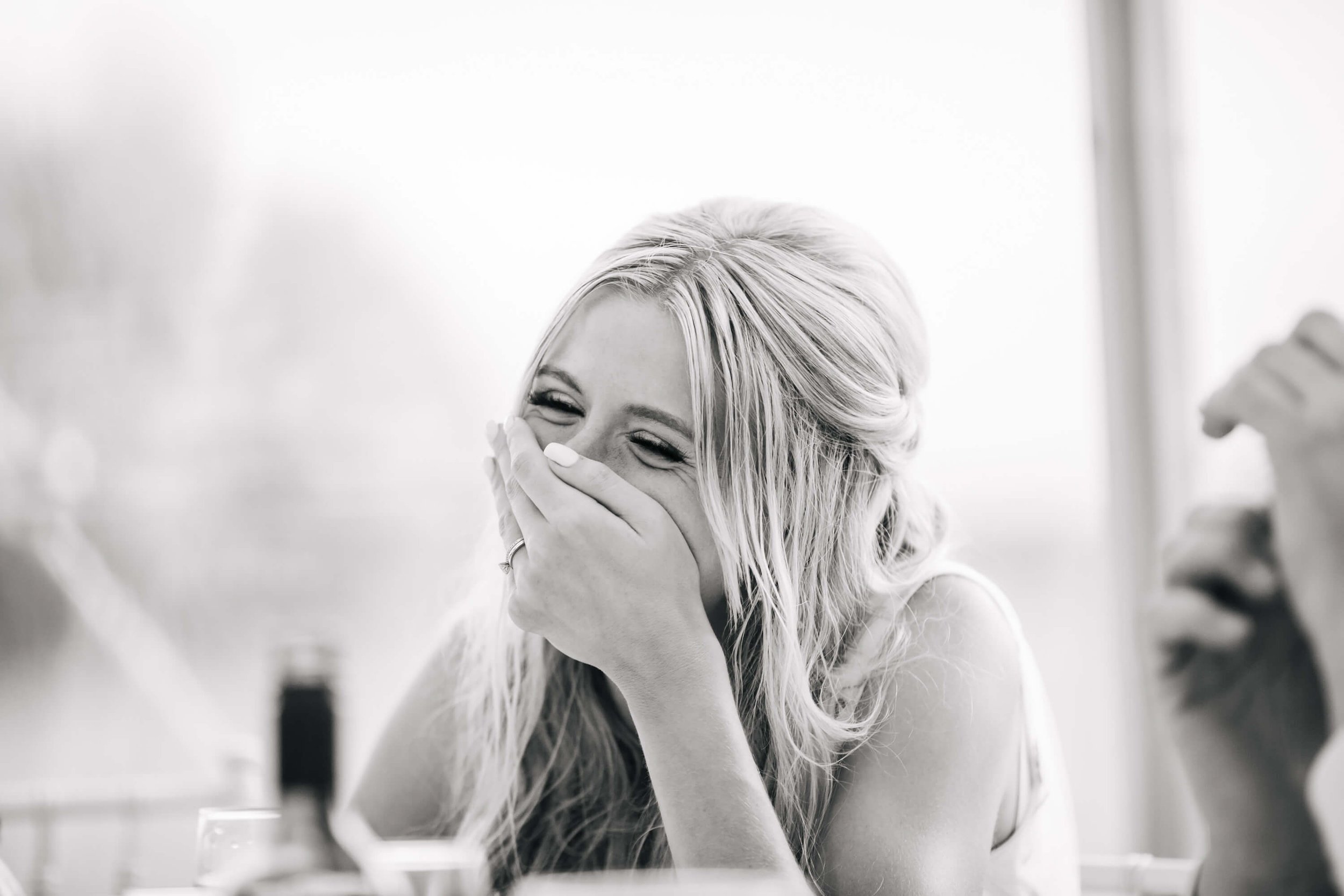 Bride laughing on her wedding day