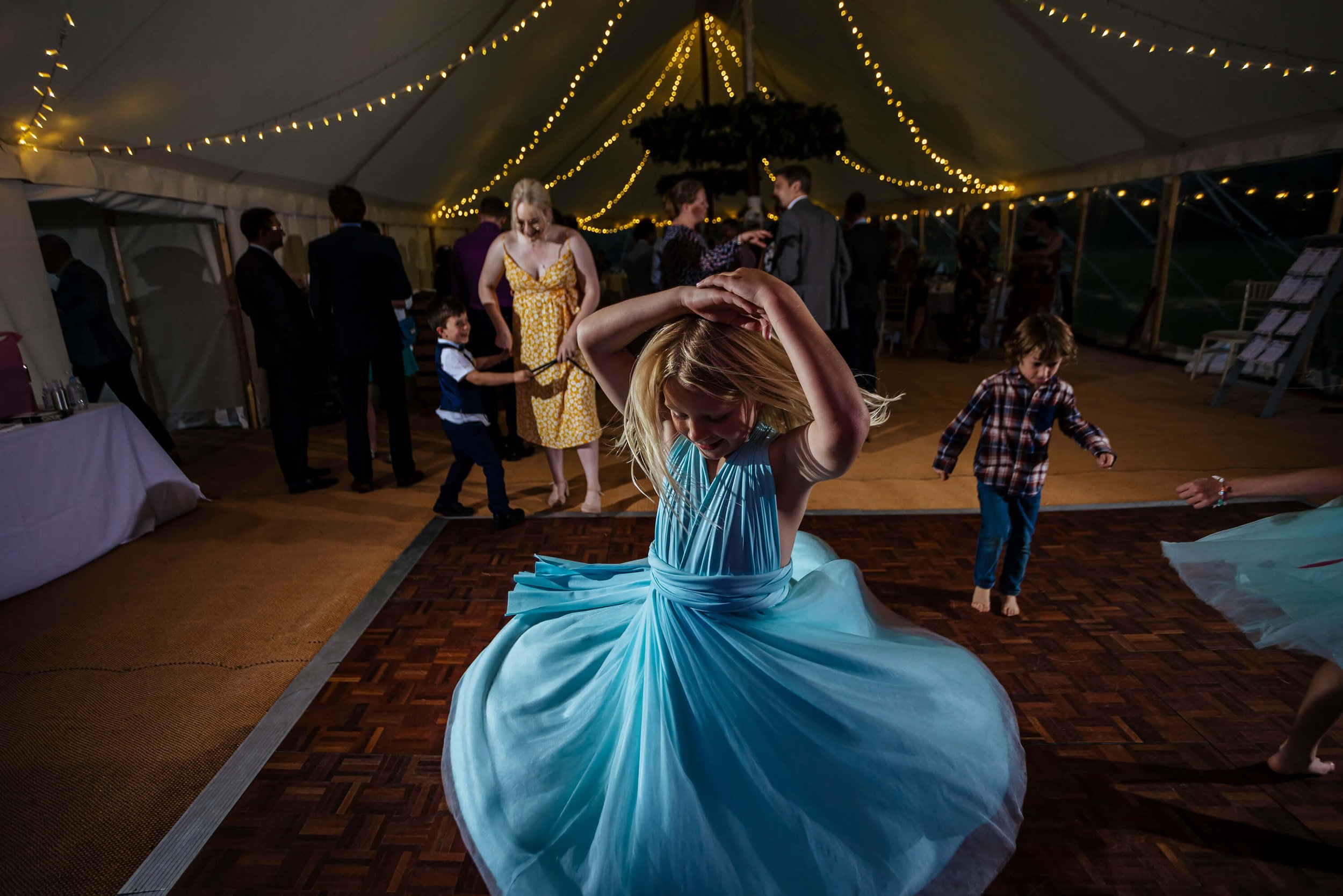 Young girl on the dance floor at a wedding