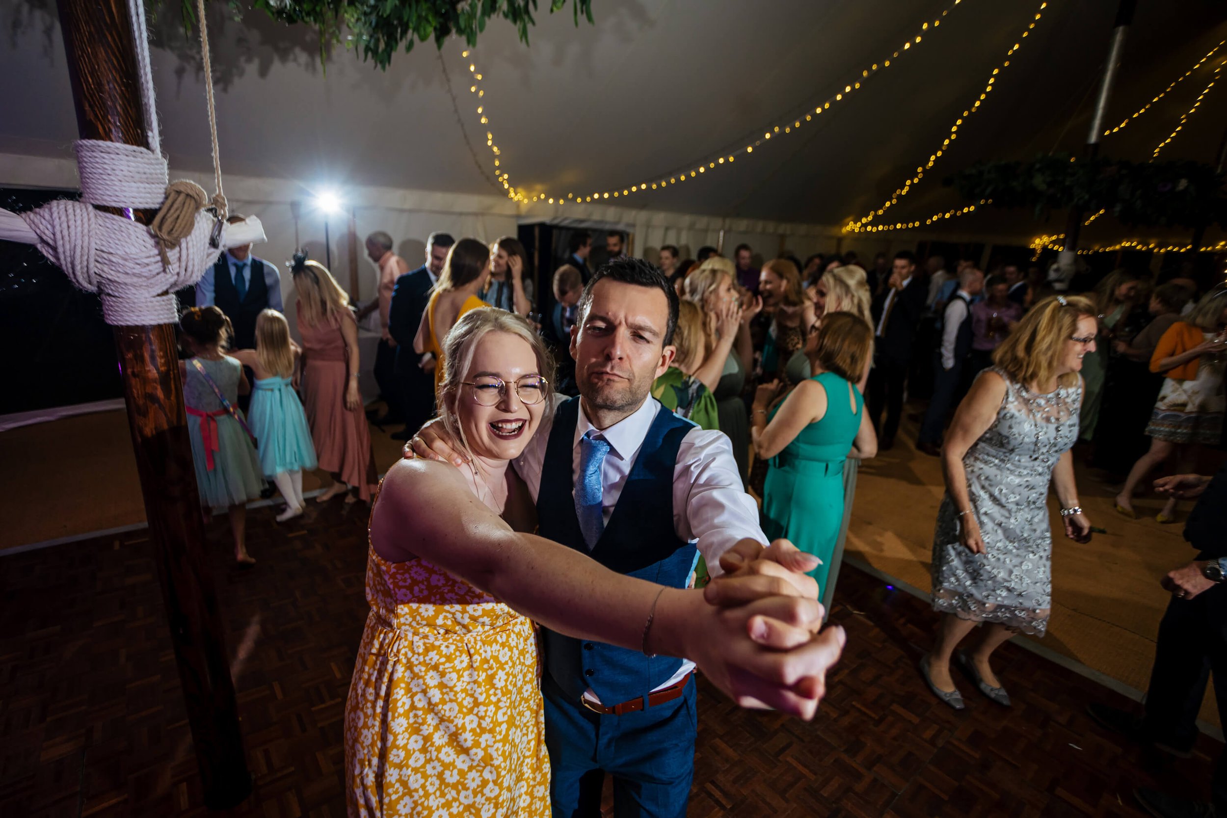 Wedding guests having fun on the dance floor