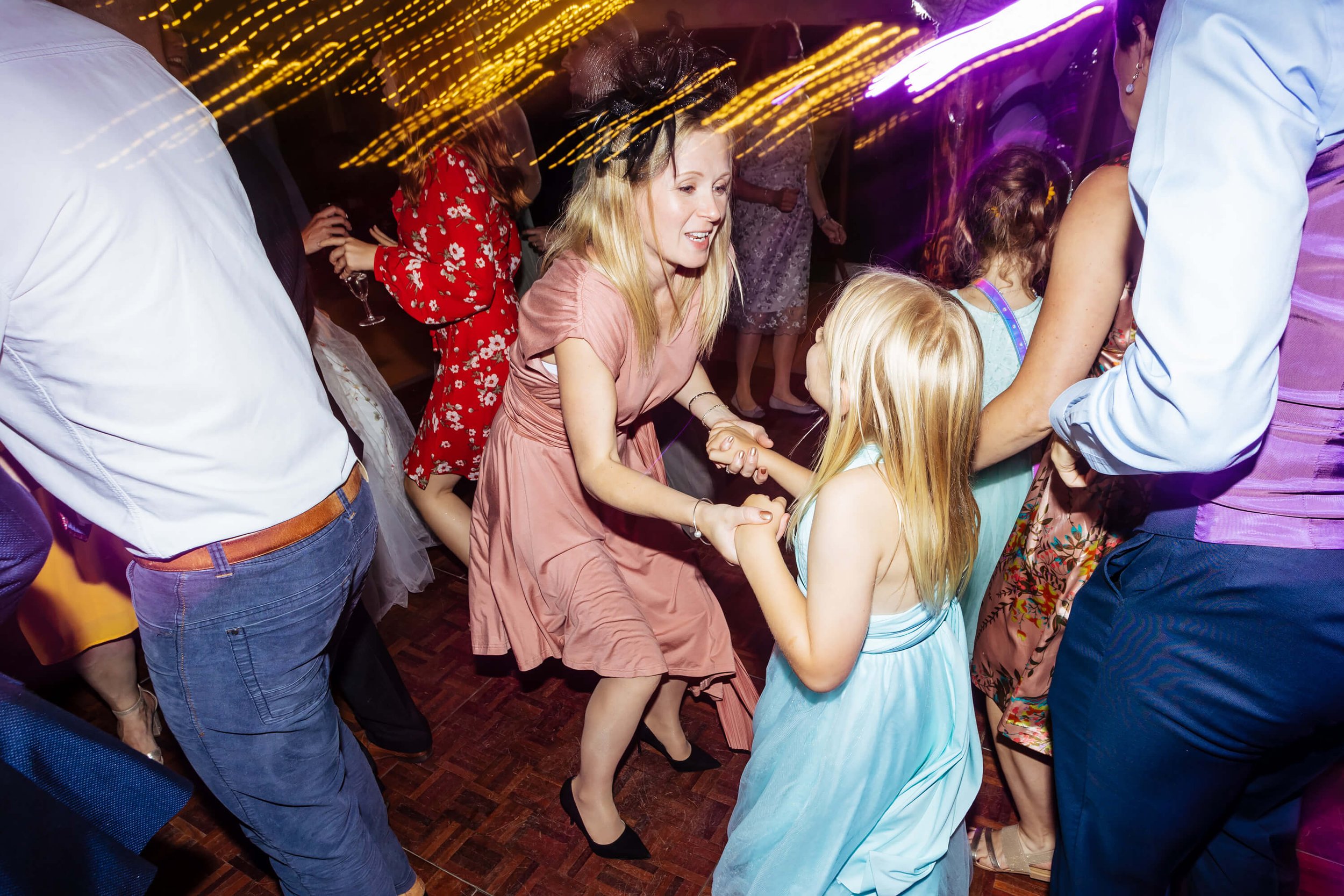 Mum and daughter on the dance floor at a wedding