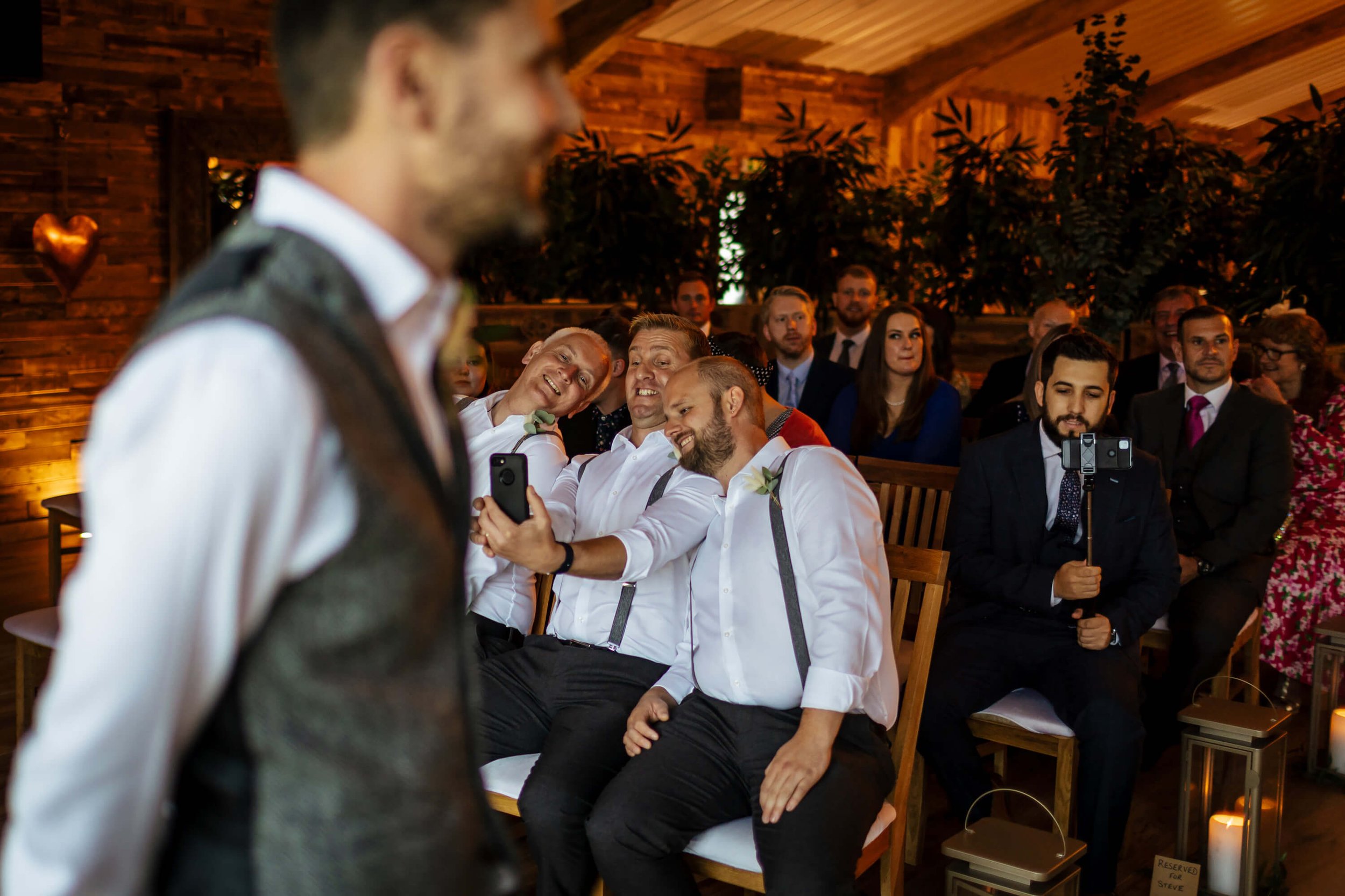 Groomsmen doing a selfie at the wedding