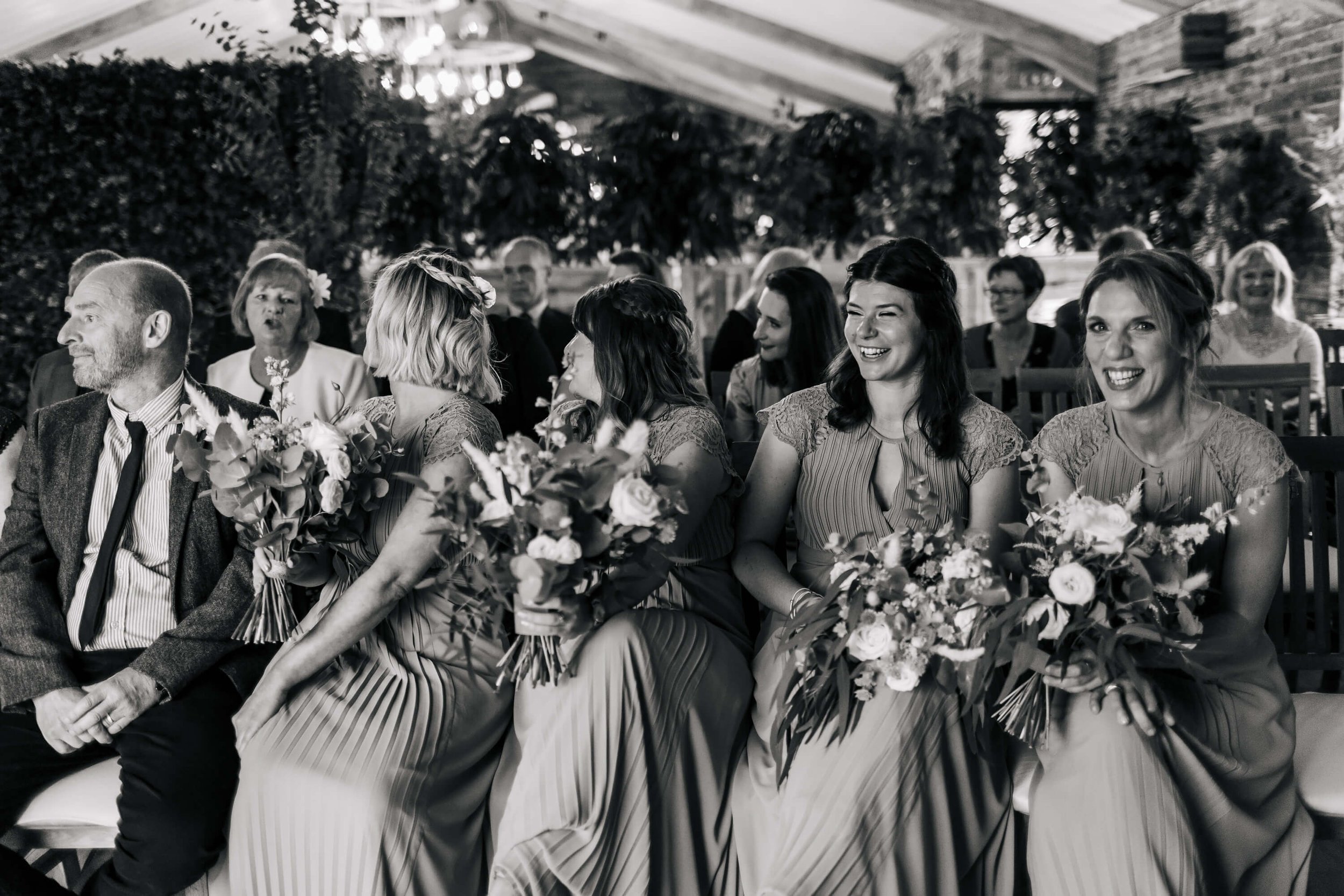Bridesmaids laughing during the wedding