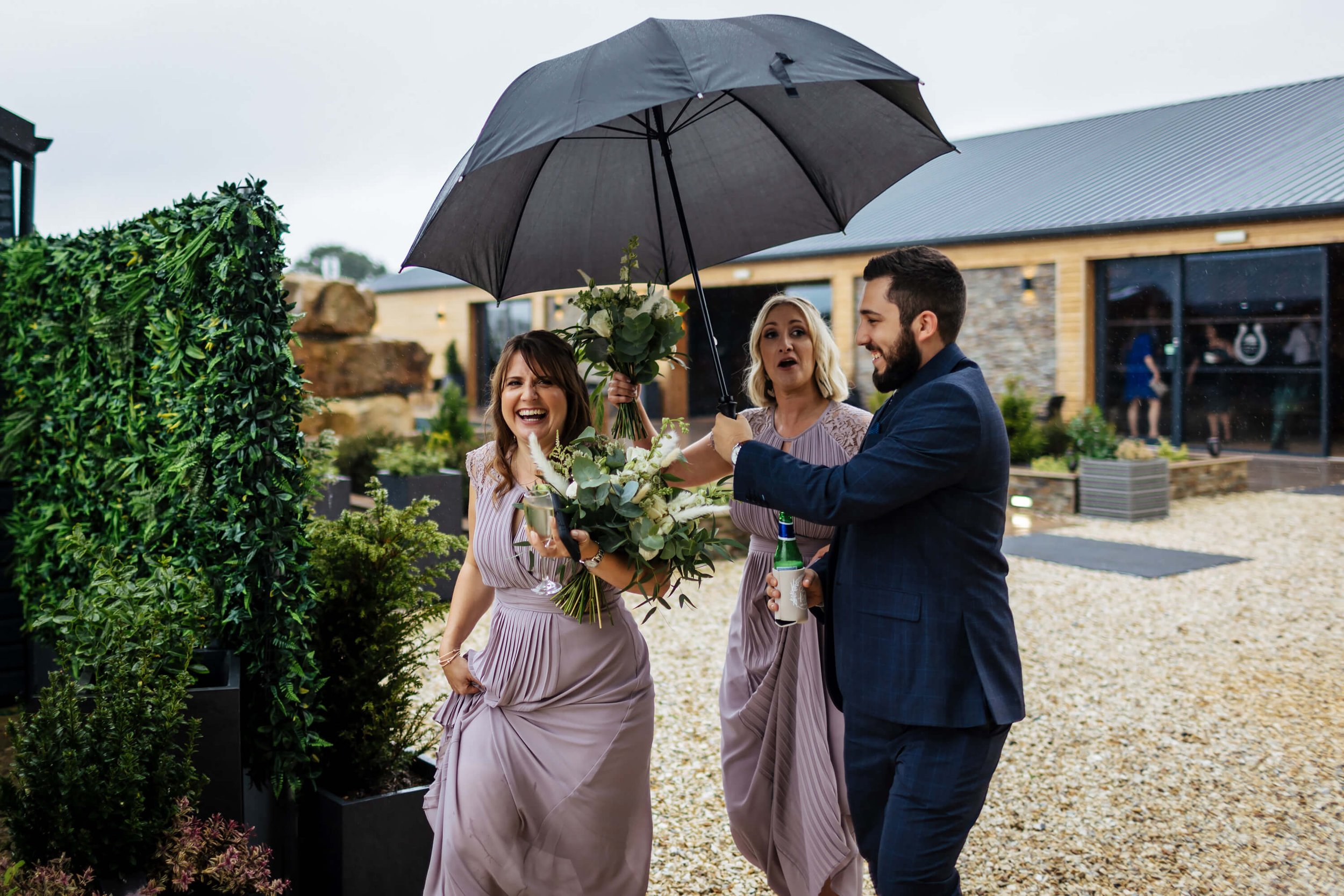 Bridesmaids under the umbrella at the wedding