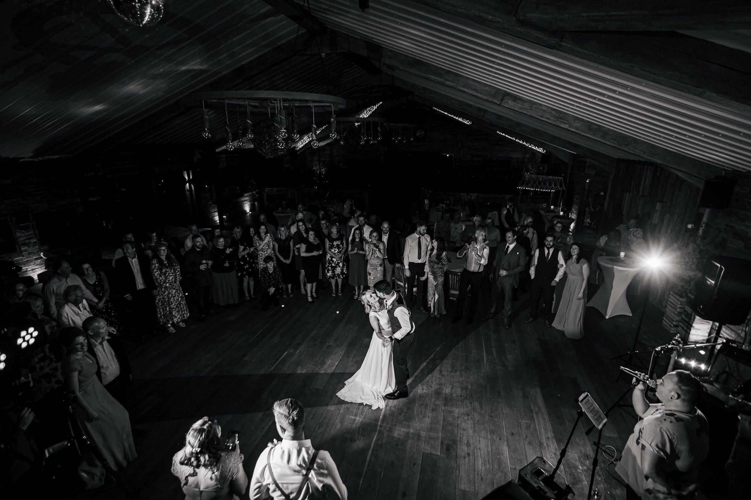 Black and white photo of the first dance at a wedding