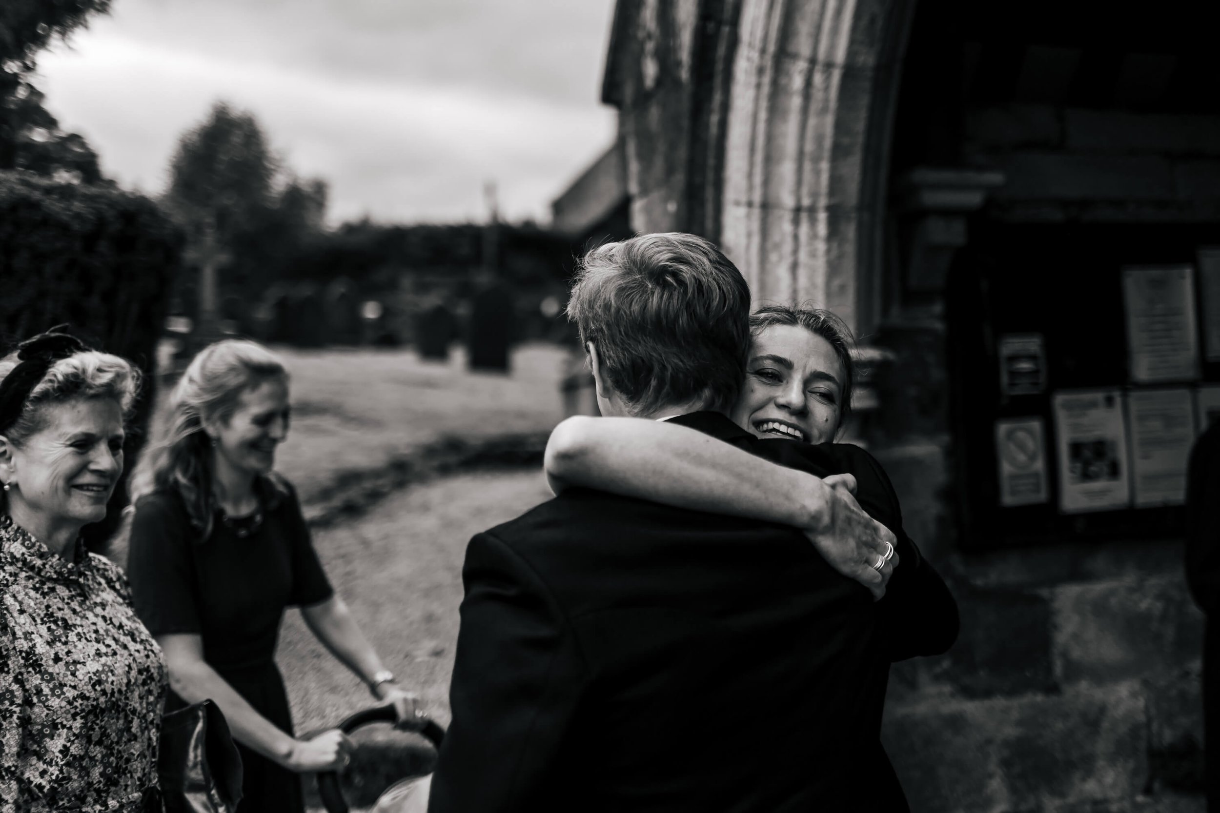 Wedding guests hugging in Yorkshire 