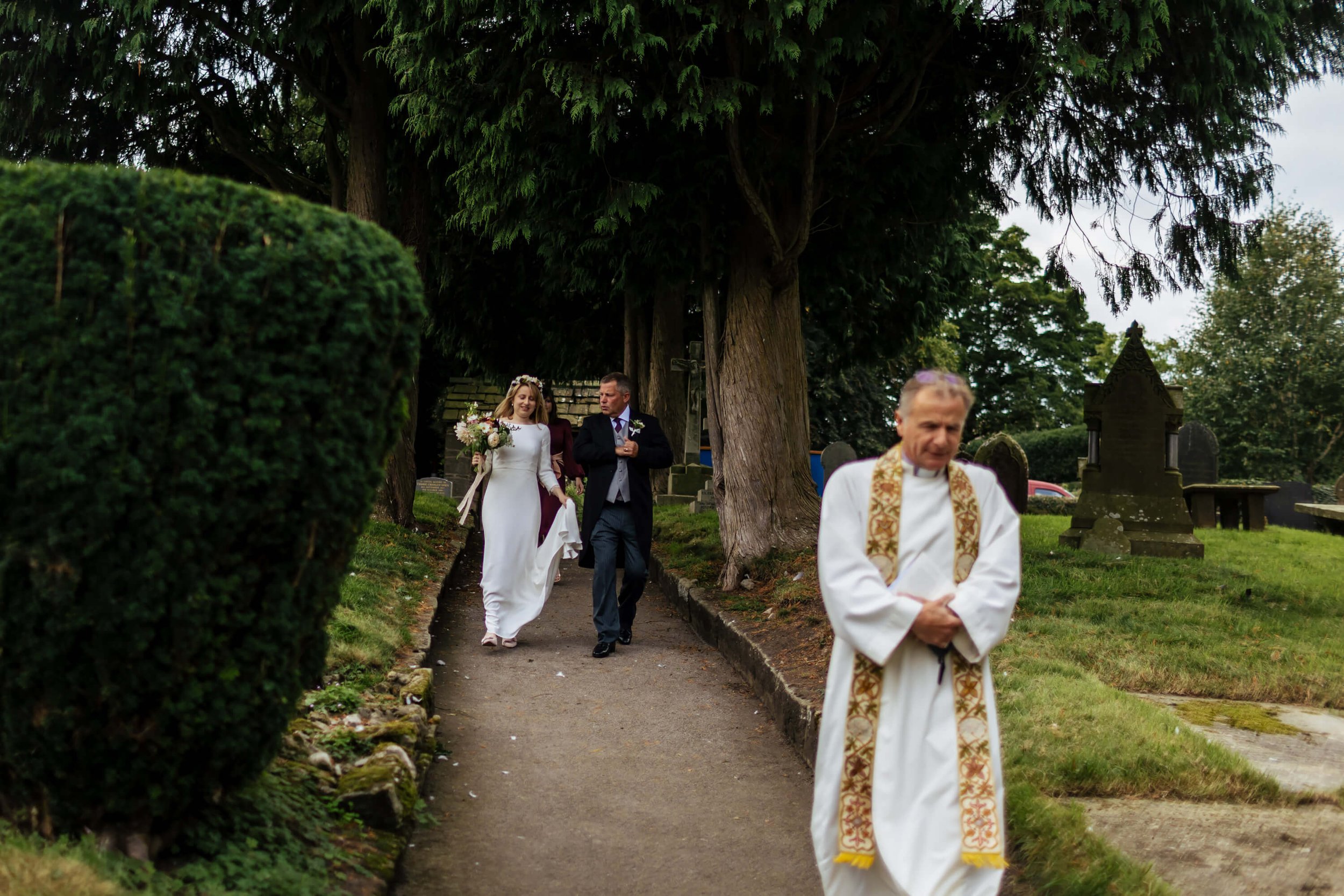 Bride walking to the church on her wedding morning with dad
