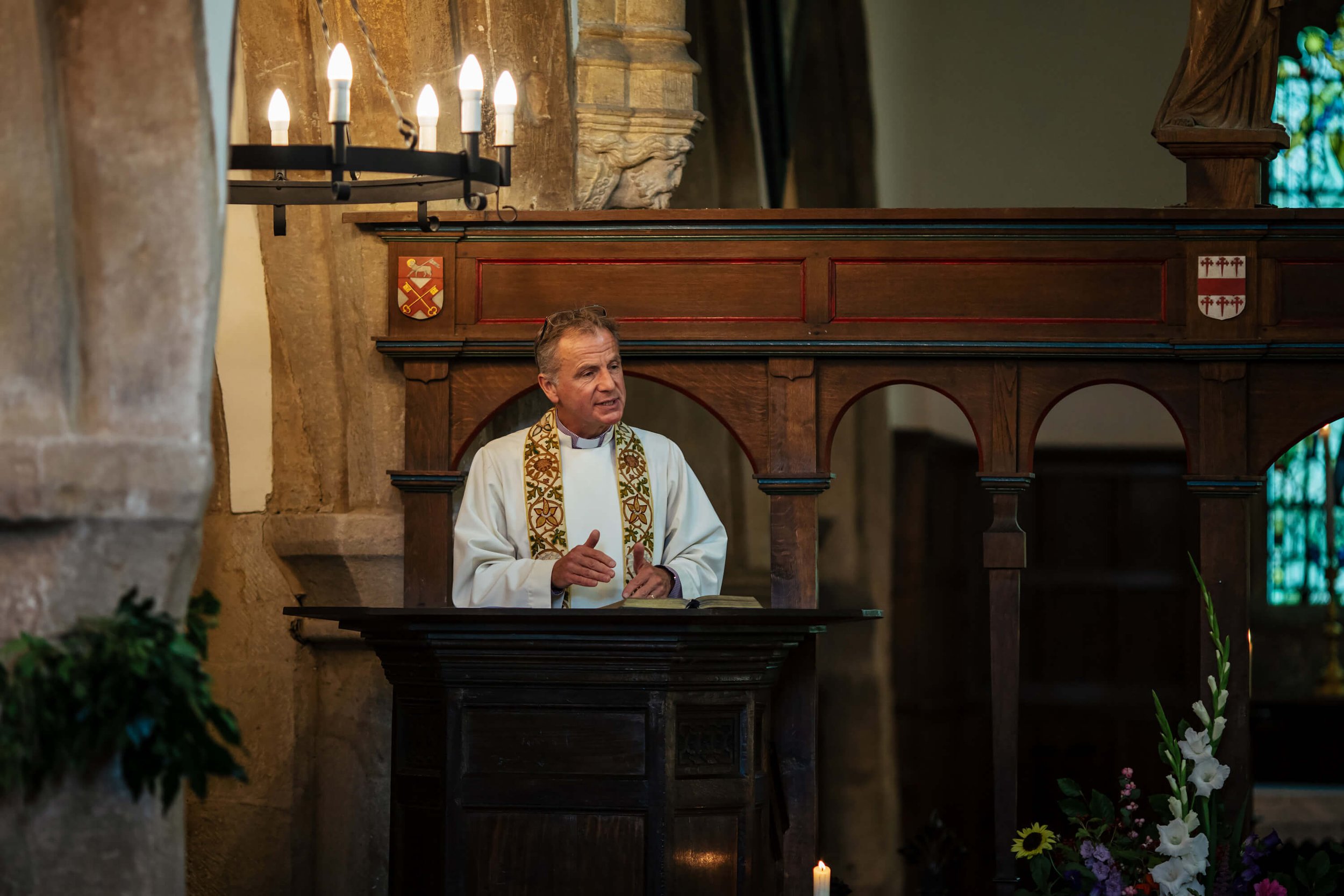 Reverend performs a wedding ceremony at a Burnsall Church wedding