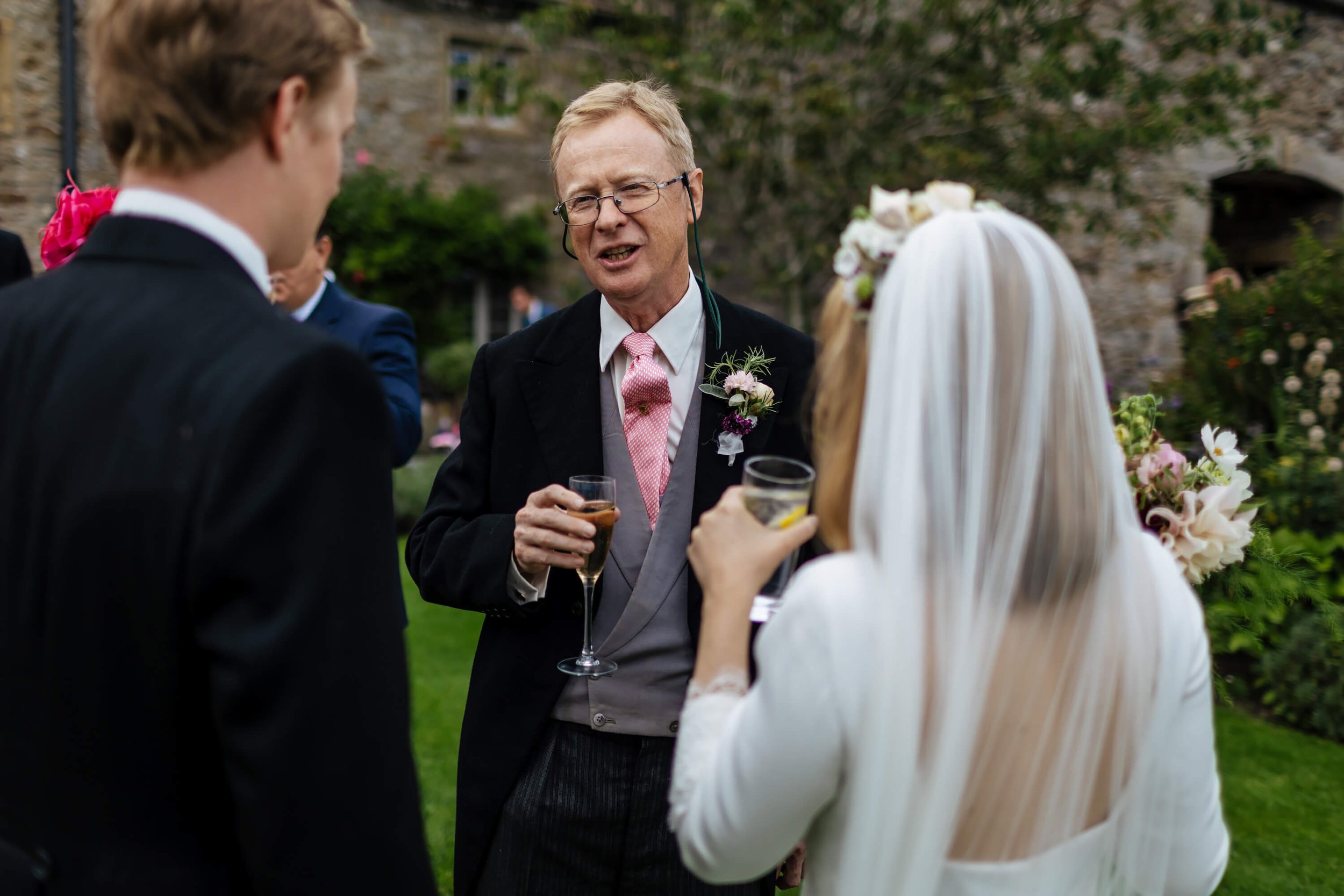 Father of the groom with a glass of bubbly at the wedding