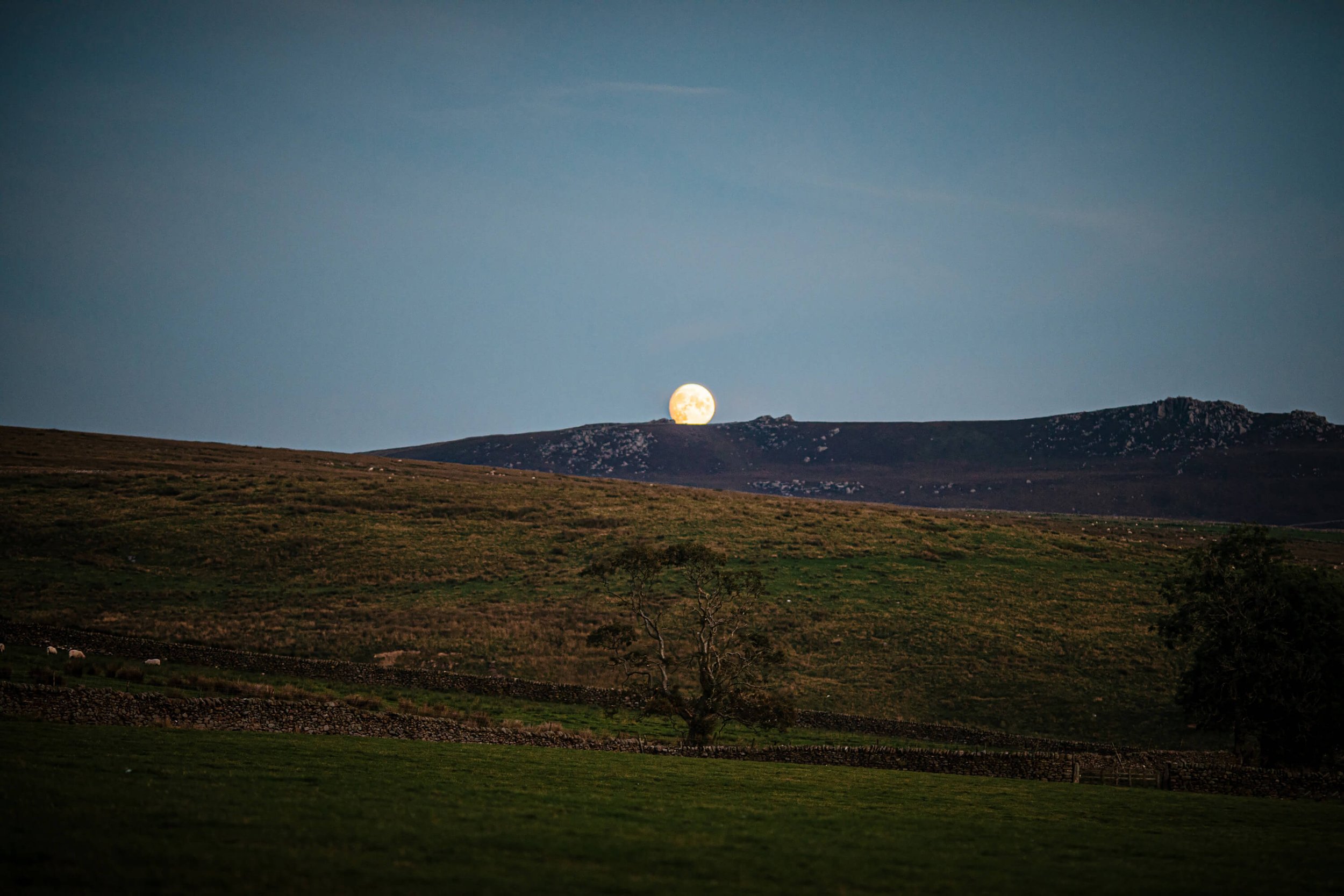 The moon rising over the rolling Yorkshire hills