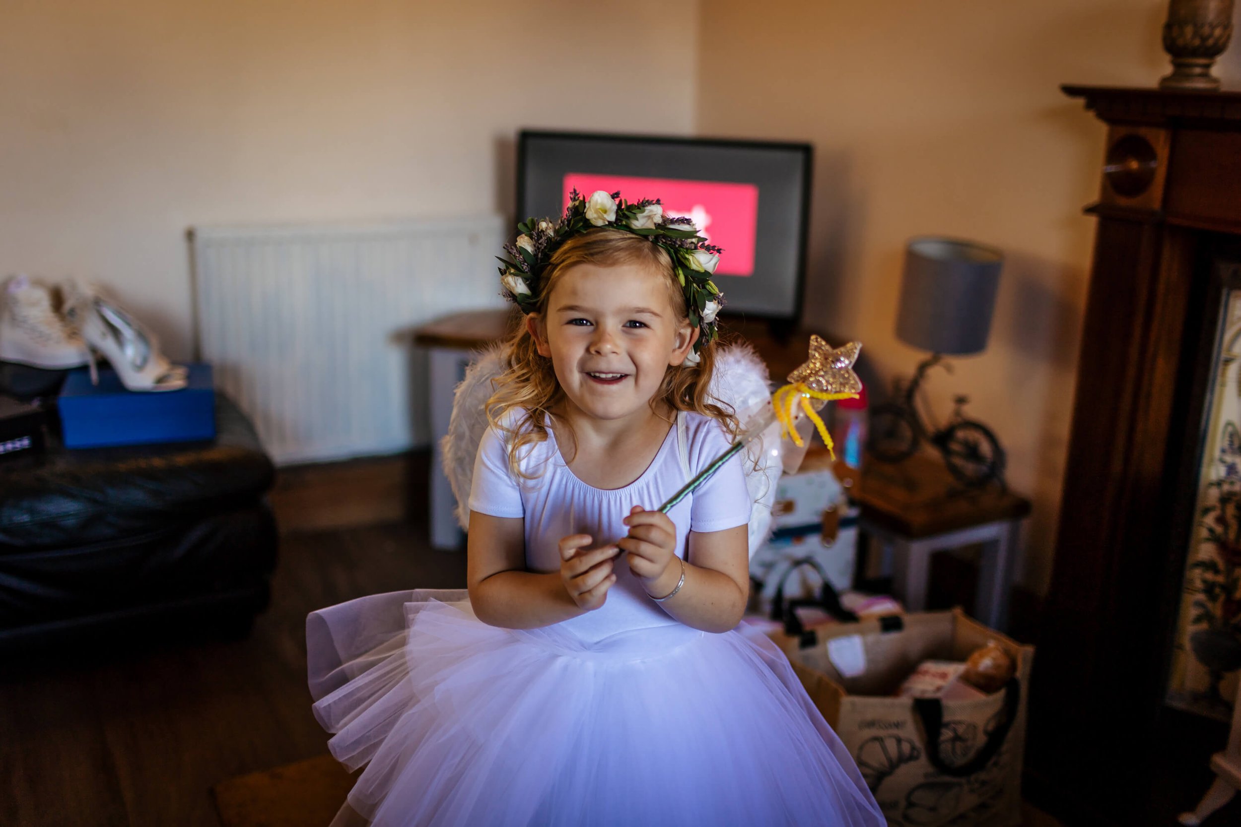 Bride's daughter ready for the wedding with her wand