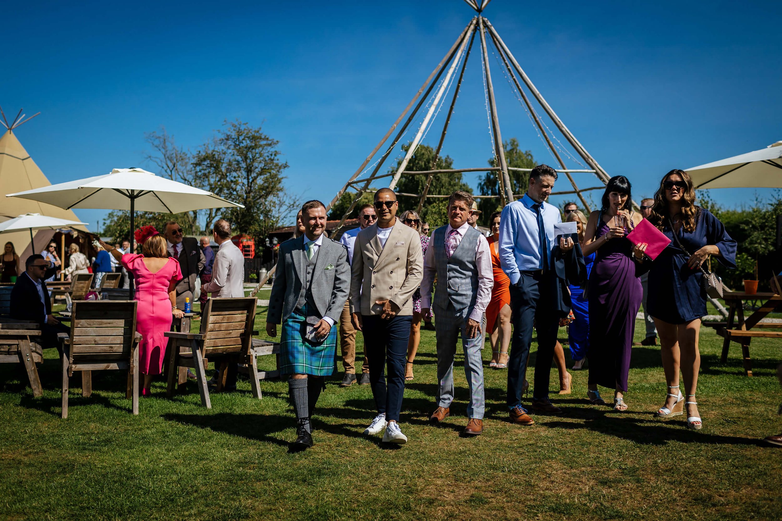 Wedding guests making their way to the ceremony