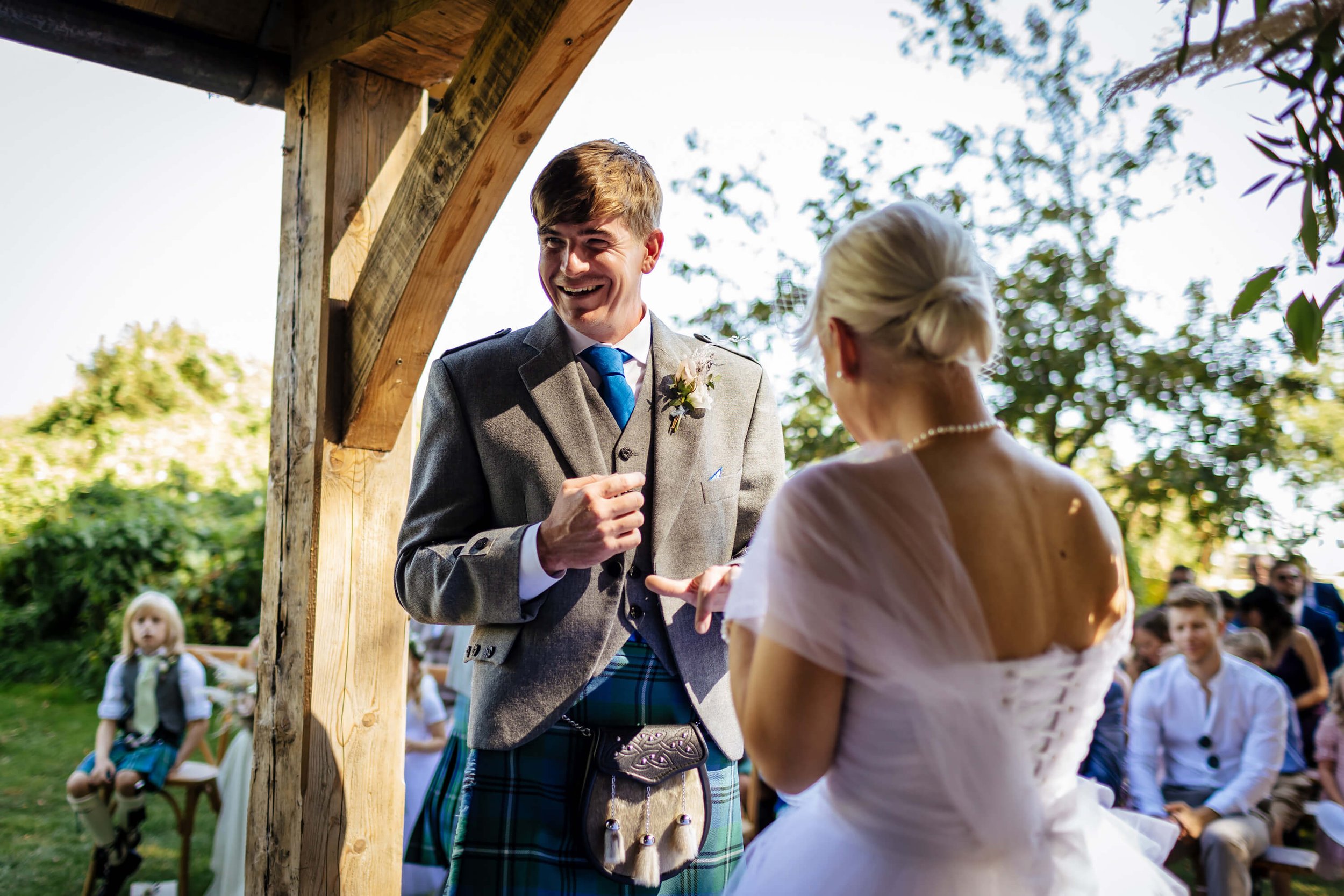 Groom smiling during the wedding ceremony