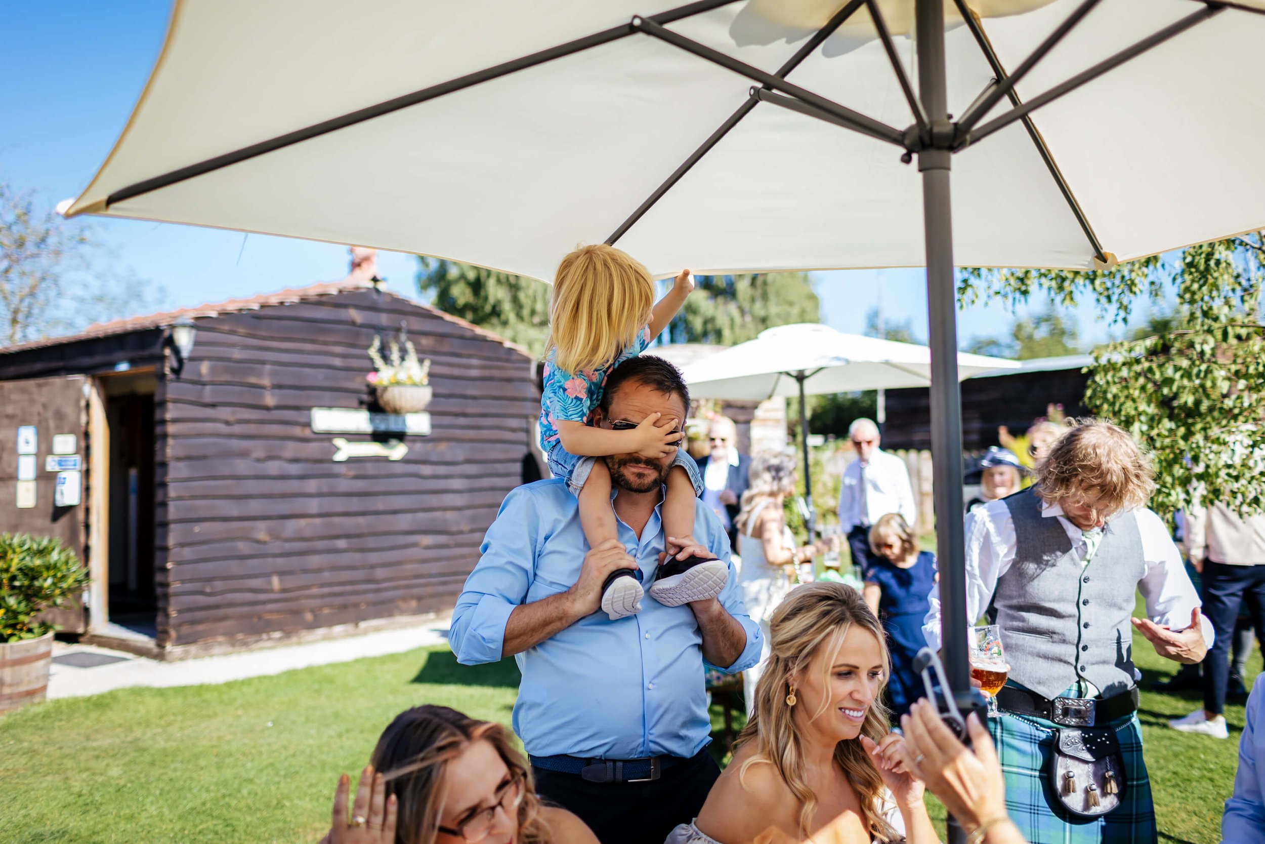 Wedding guests having fun in the sunshine