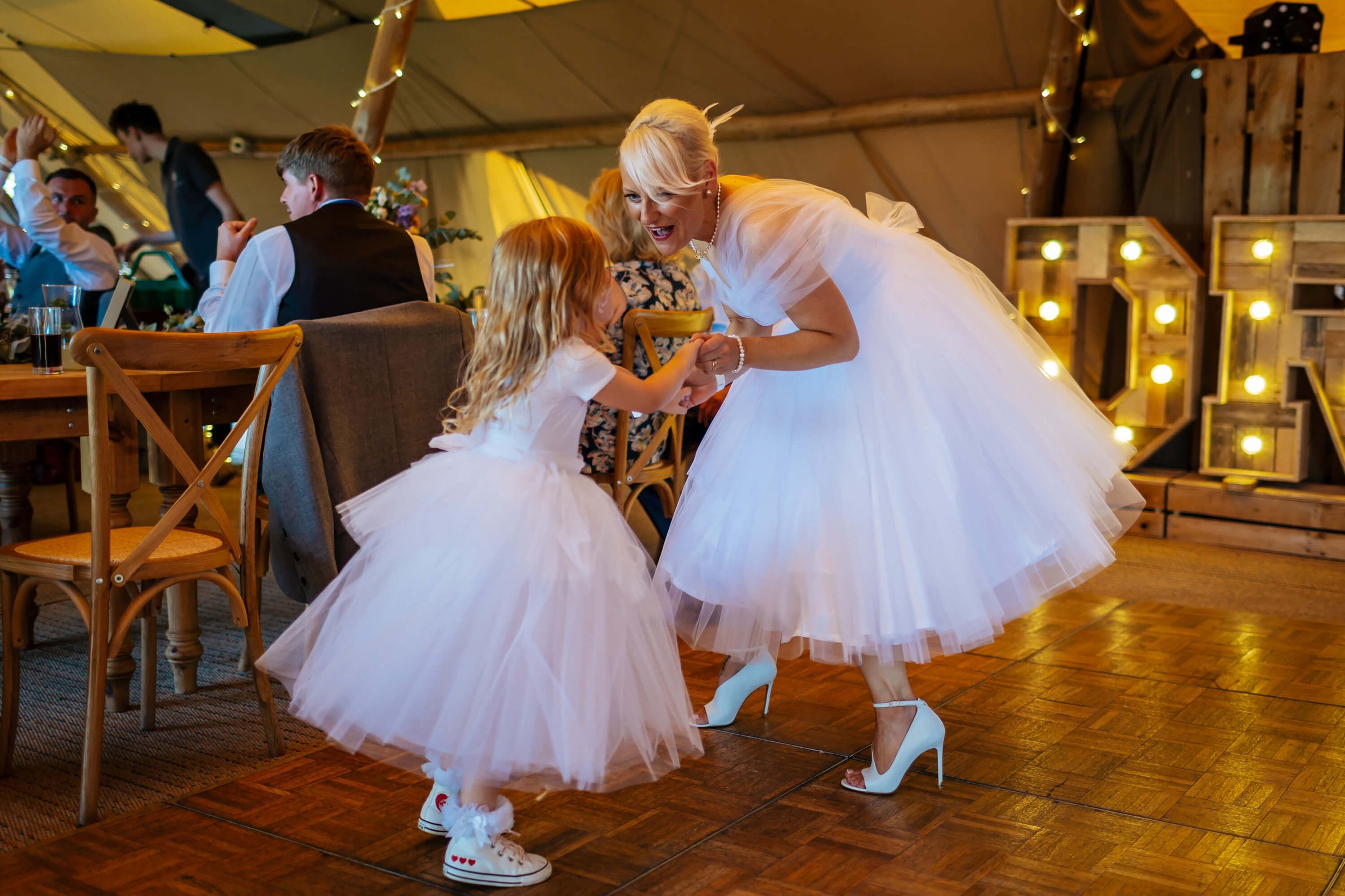 Bride and daughter dancing on the dance floor