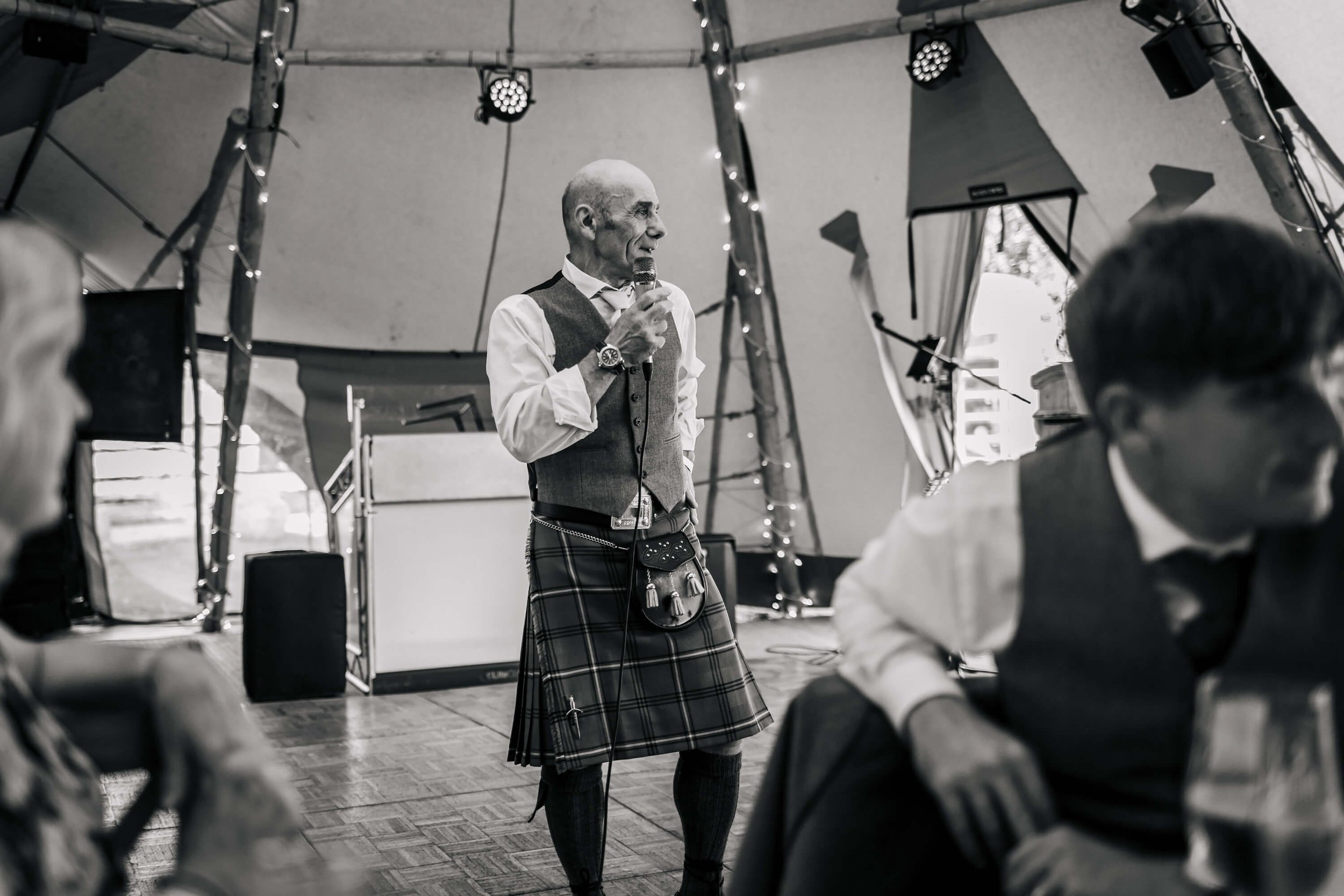 Father of the bride giving his speech at the wedding reception