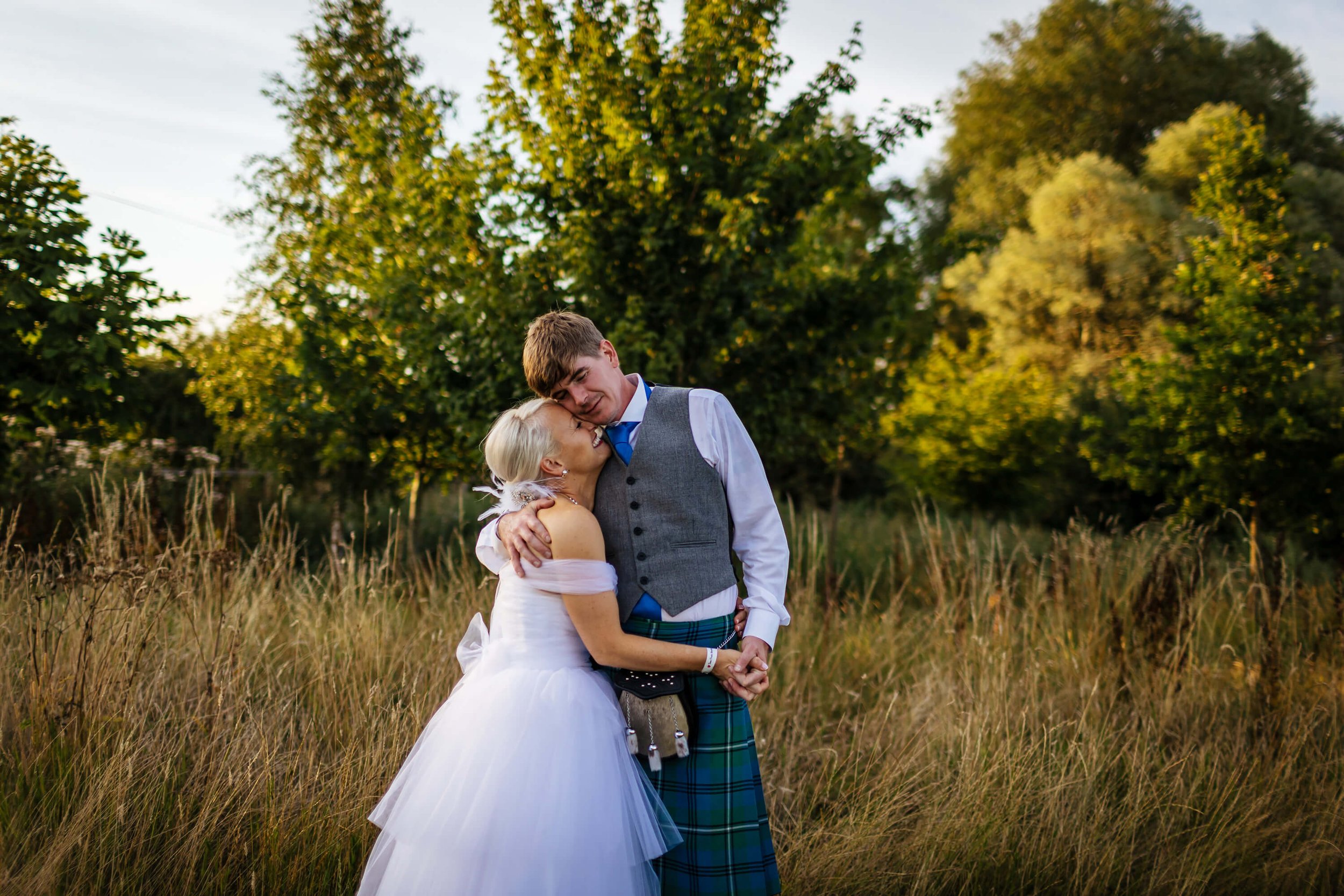 Portrait of the bride and groom at sunset