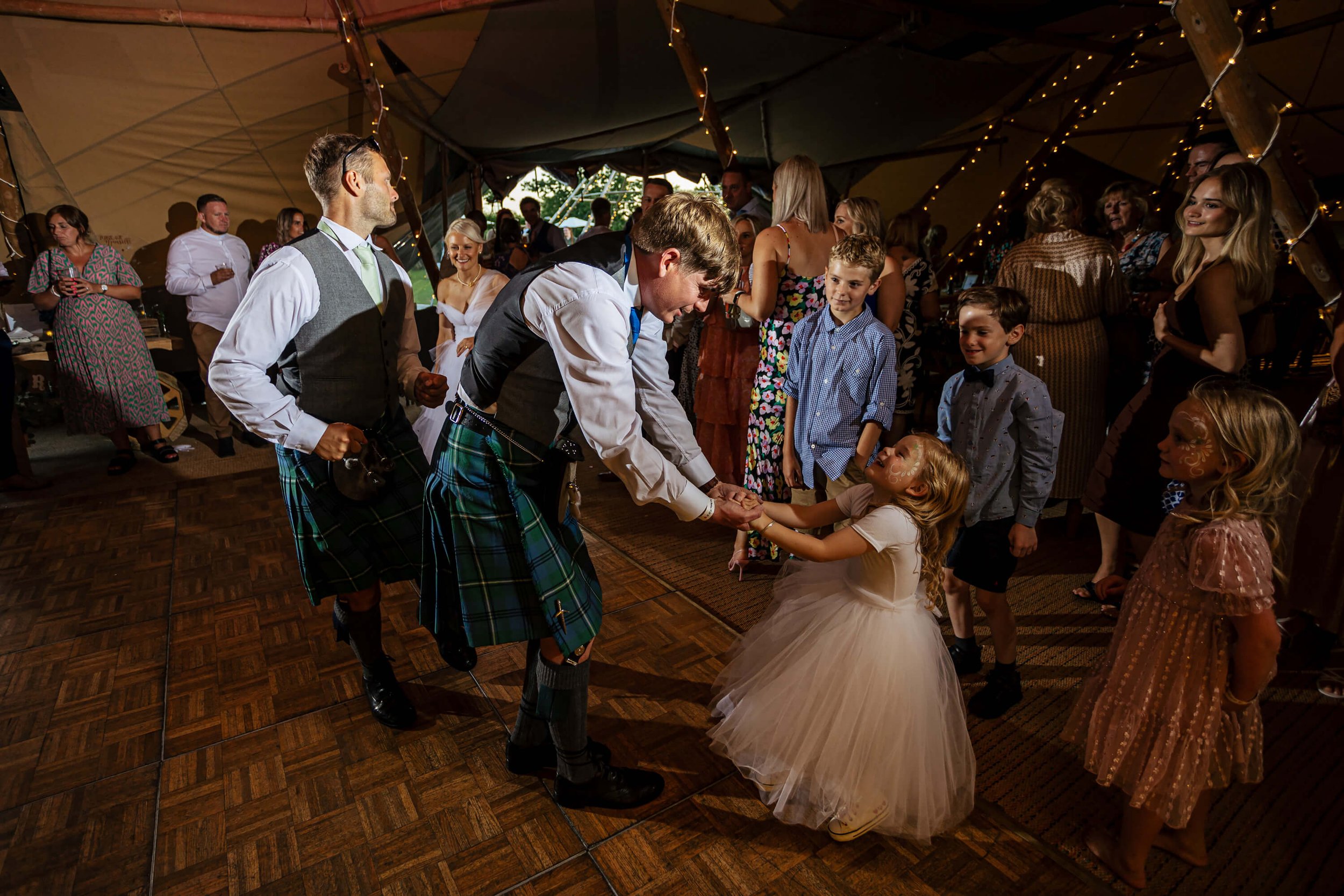 Groom and daughter on the dance floor at a wedding