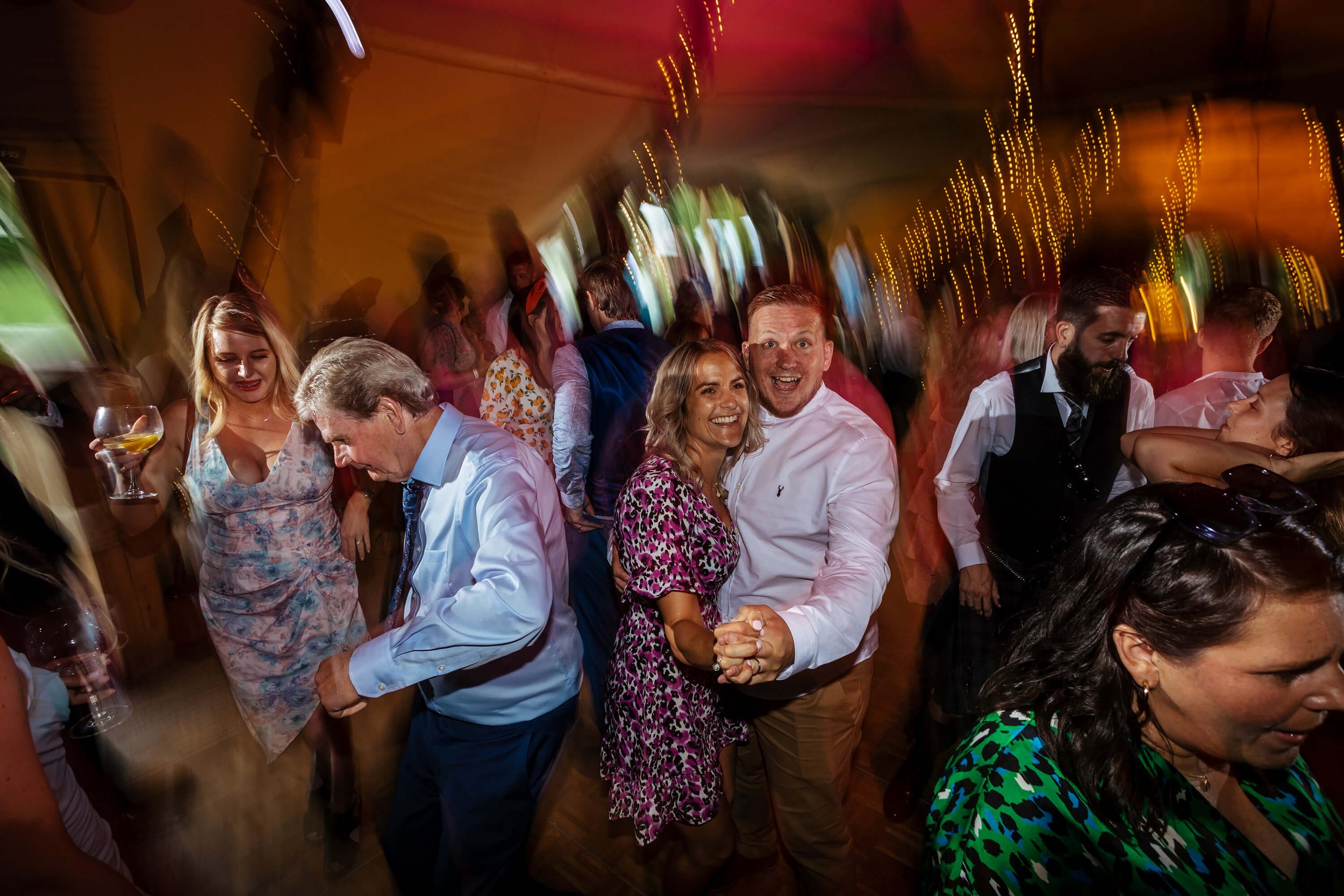 Wedding guests dancing to a DJ