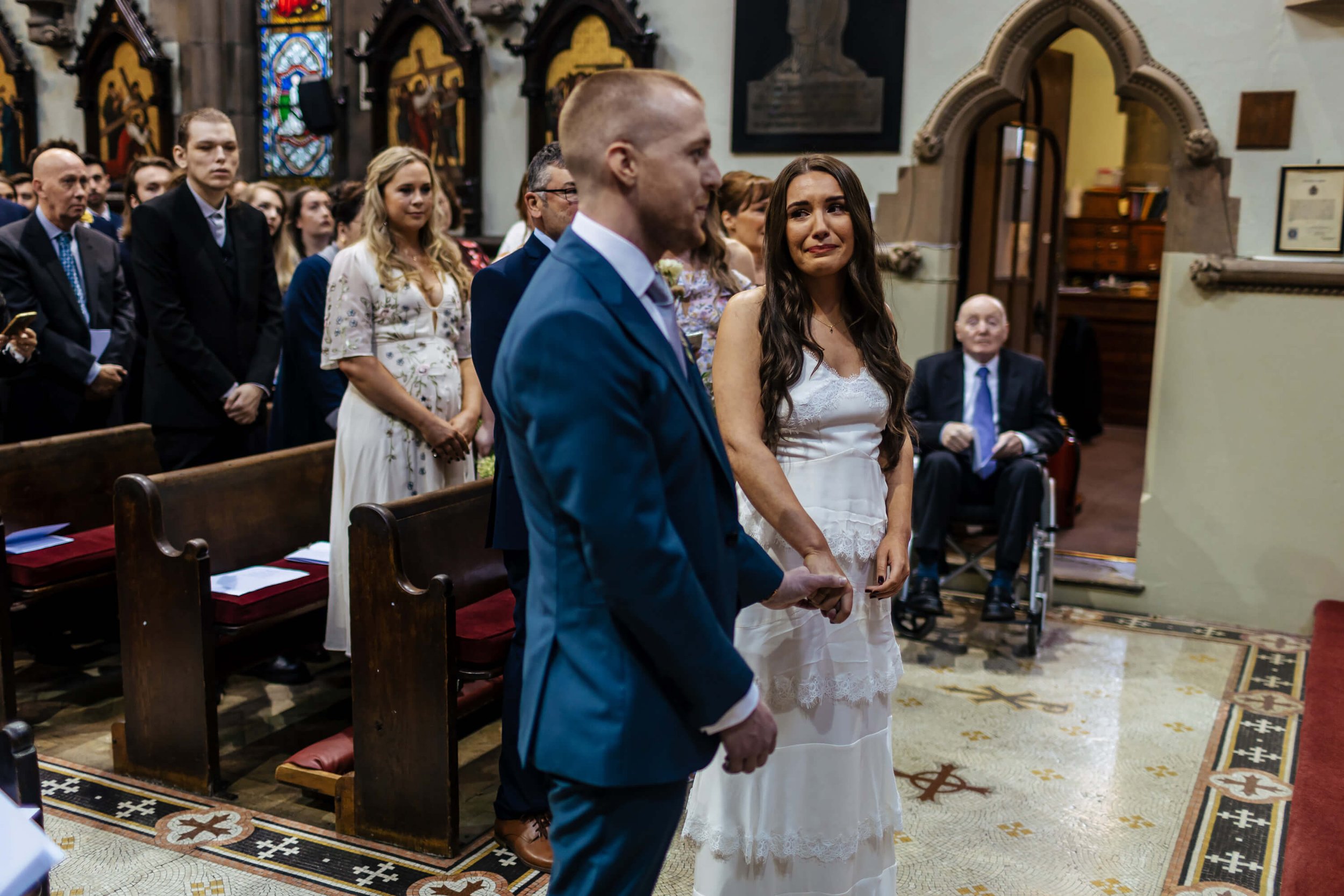 The bride getting emotional during her church wedding